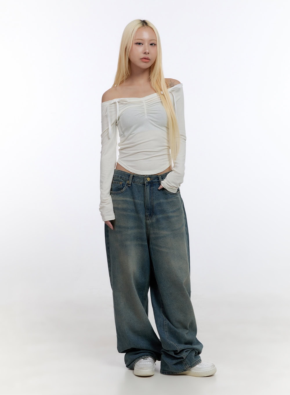 Zola Casual Fit Denim Jeans CO422 in blue, full-length front shot on model, street-style acubi look paired with white off-shoulder ruched long-sleeve top and white sneakers.