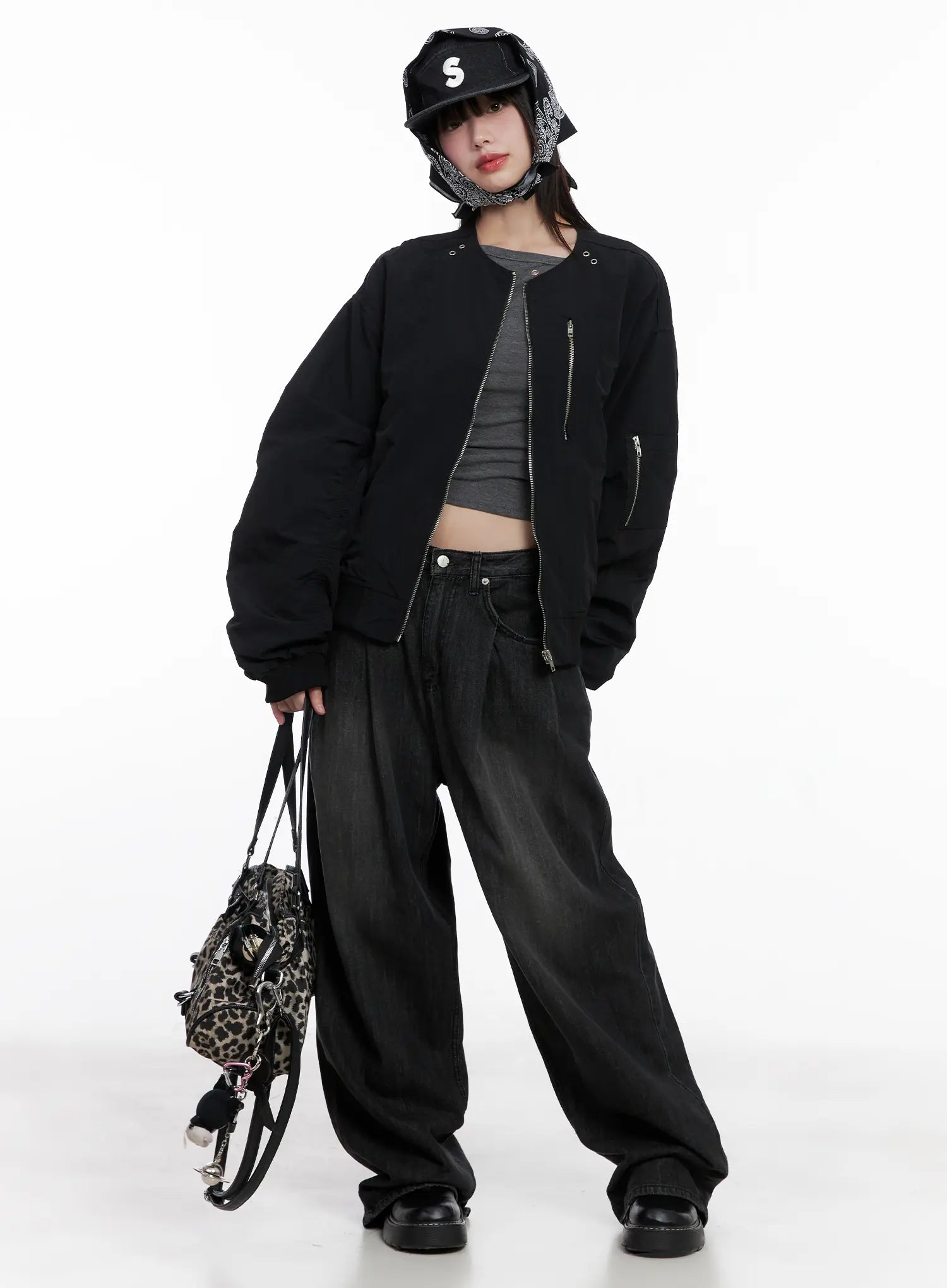 Elen Pintuck Baggy Jeans CG519 in black, full-body street style look on model, paired with black bomber jacket, gray crop top, bucket hat, and leopard print bag.