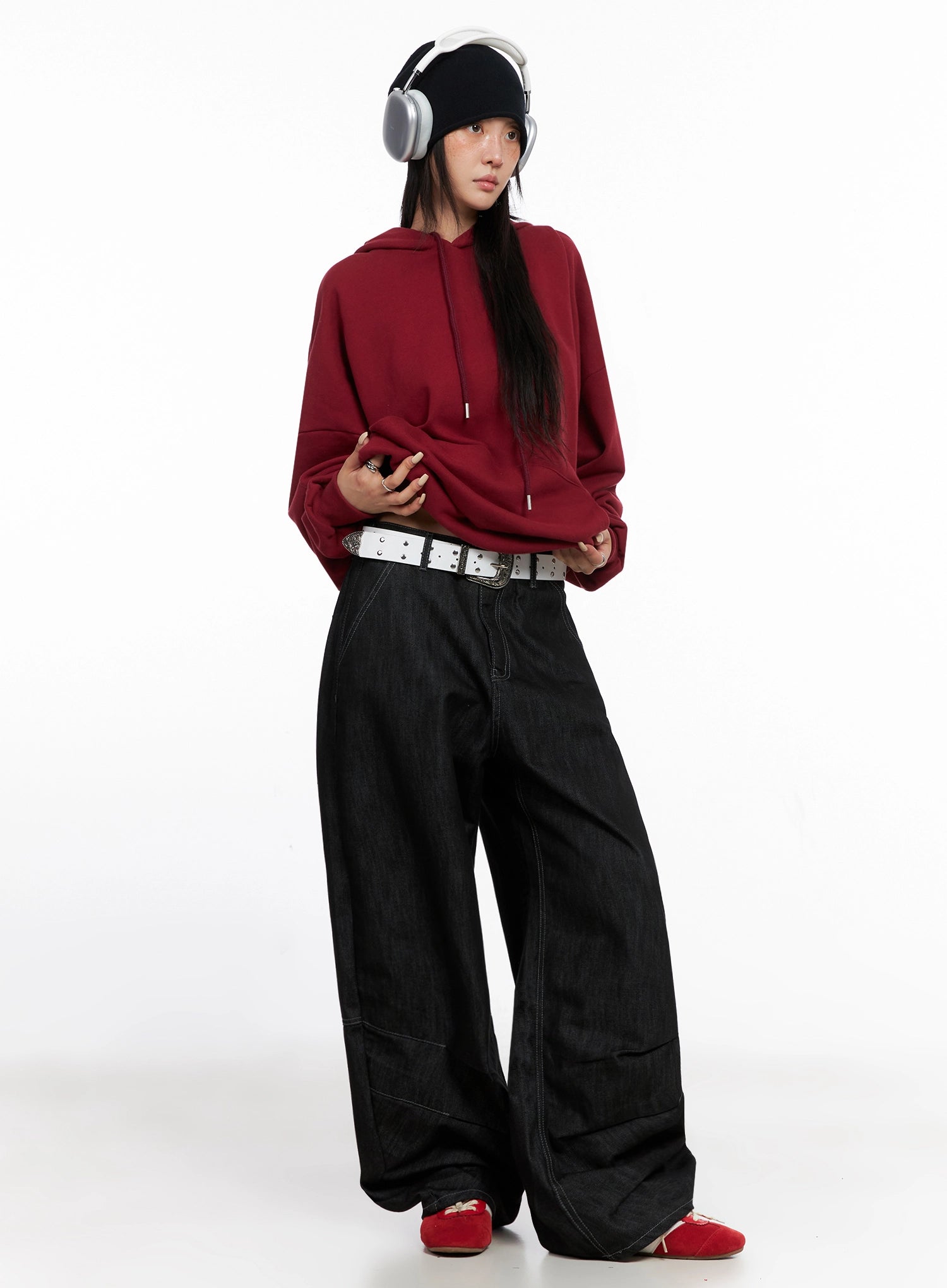 Leyla Pin-Tuck Wide-Leg Jeans IS515 in black, full-length front on model wearing red hoodie and white belt, oversized wide-leg silhouette with pintuck seams.