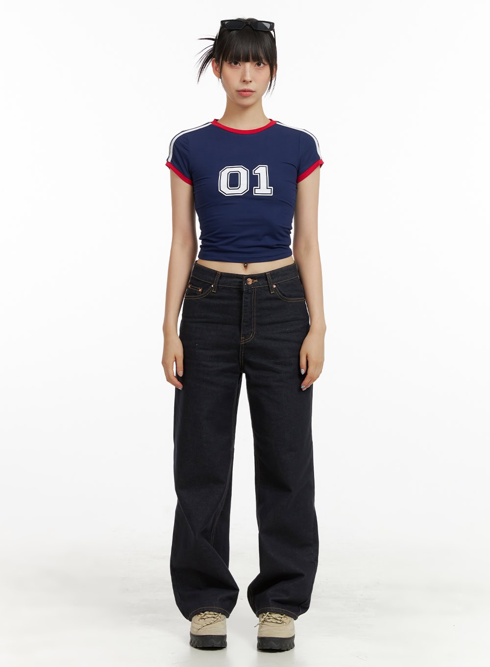Indigo Stitched Straight Jeans CU424 in dark blue, full-body front shot on model, straight leg silhouette styled with navy varsity crop tee and sneakers.