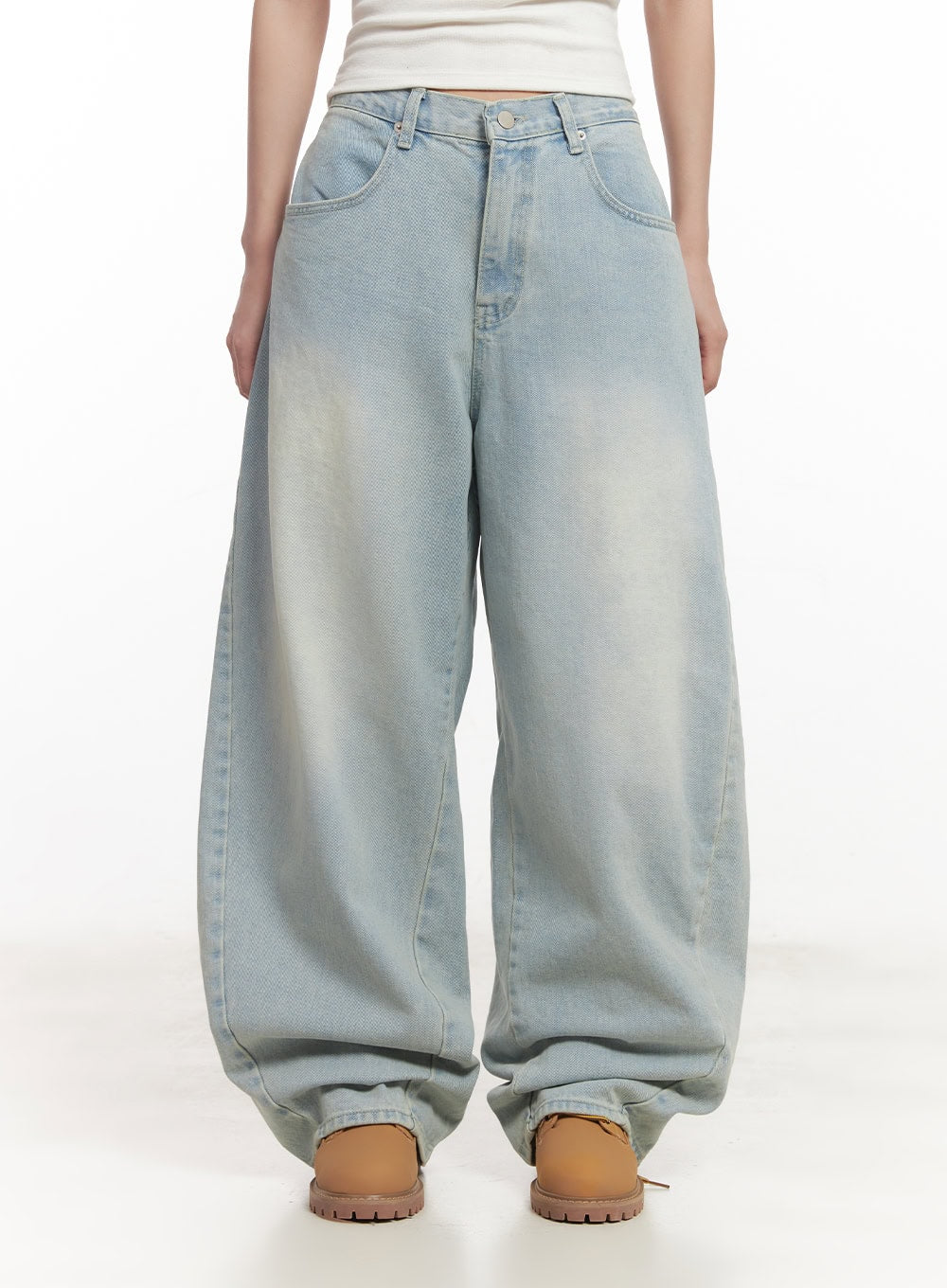 Alia Washed Wide-Leg Jeans CA518 in light blue, front waist-to-hem product shot on model, voluminous wide-leg silhouette with washed gradient and front pockets, worn with white crop top.