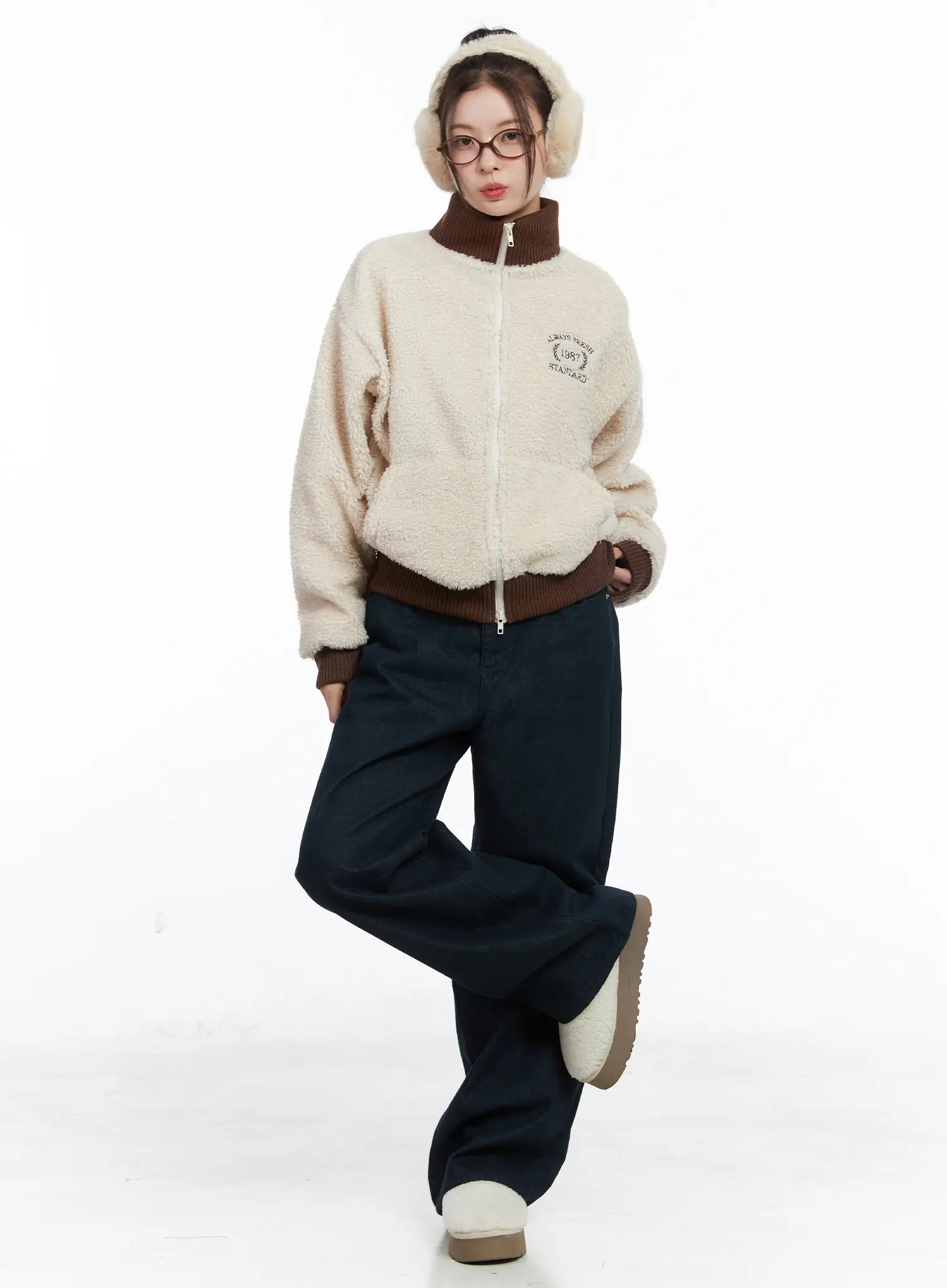 Drew Non-Fade Relaxed Fit Wide Jeans CN519 in dark blue, full-body front styling shot, model in fluffy zip-up jacket and earmuffs, relaxed wide leg silhouette pooling at hem.