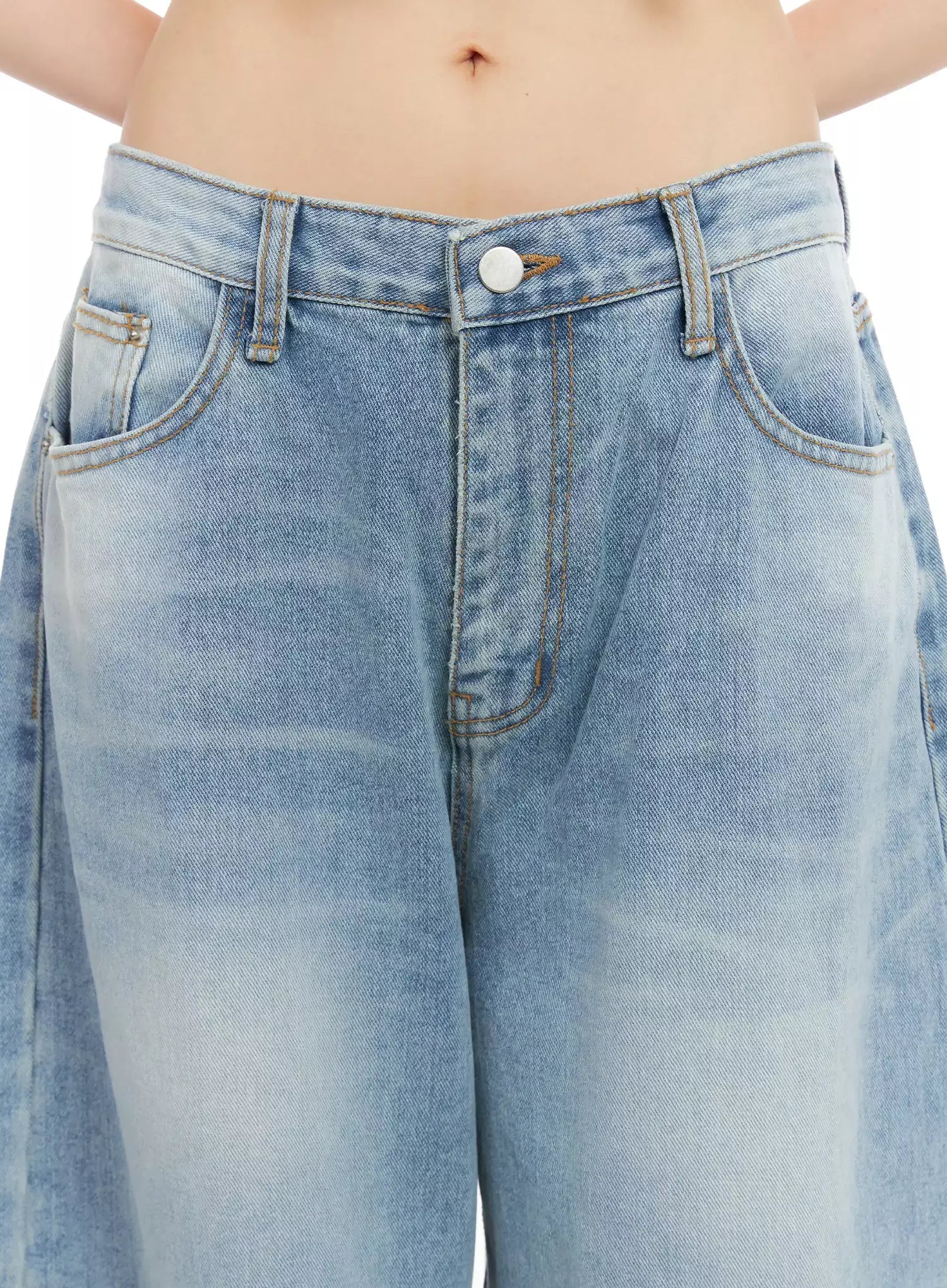 Dain Washed Wide-Leg Jeans IL531 in light blue, close-up detail of waistband and front pockets, silver button closure, contrast stitching, and sun-faded washed denim texture.
