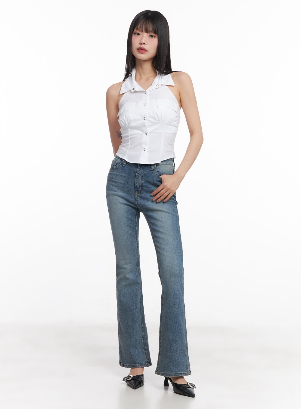 Cassy Slim Washed Flared Jeans CY512 in blue, full-body front view on model, slim flared leg with washed cotton-spandex denim, paired with white halter top and black heeled mules.