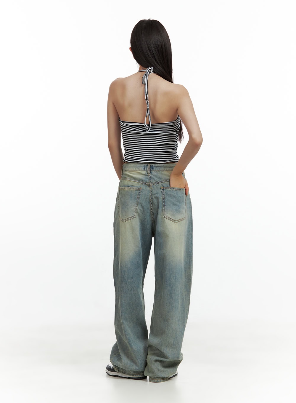 Relaxed Wide-Leg Jeans CU420 in blue, back full-length view on model, washed denim showing two back patch pockets with contrast stitching, wide leg silhouette, halter crop top styling.