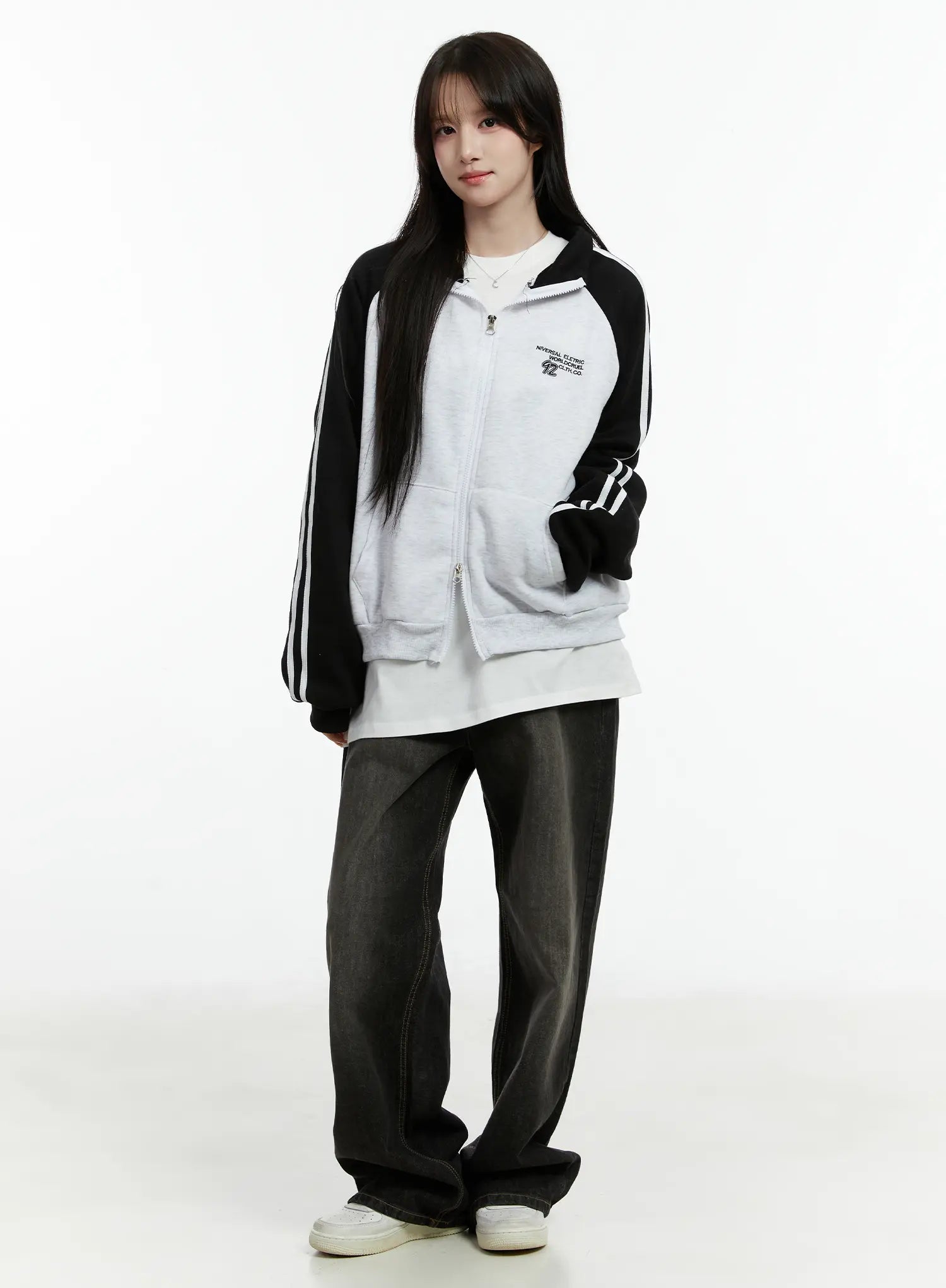 Haze Washed Wide-Leg Jeans CD523 in black, full-body front shot on model, wide-fit long cotton denim with washed fade, styled with varsity zip-up and white tee.