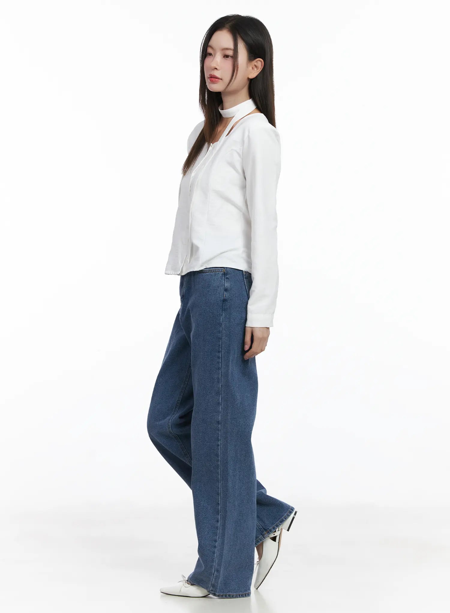 Ashlyn High-Waist Fleece-Lined Wide-Leg Jeans CJ507 in blue, side view on model, long wide-leg silhouette showing inseam length, paired with white long-sleeve top and white flats.