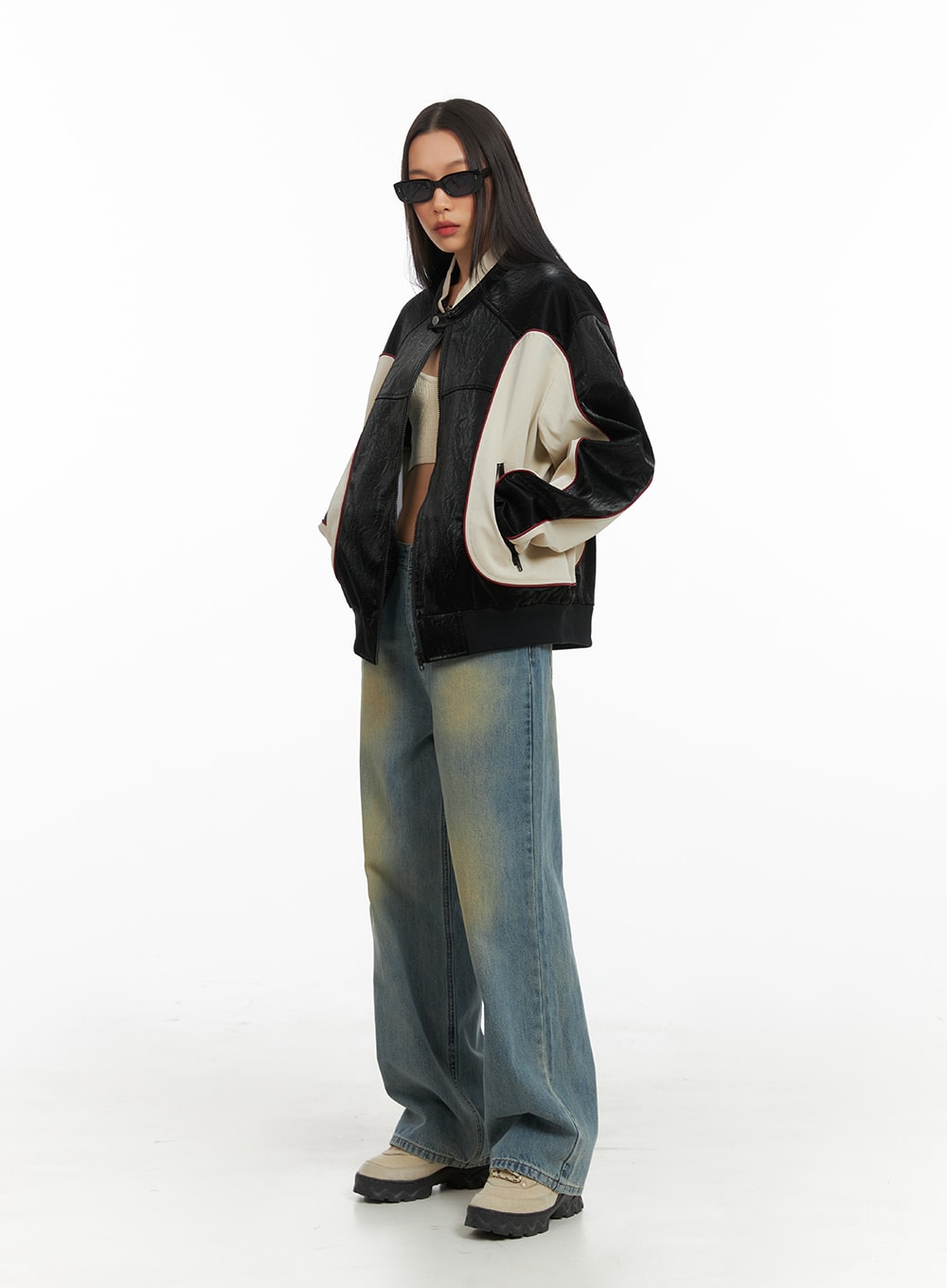 Washed Denim Wide Leg Jeans IA417 in blue, three-quarter side view on model, relaxed wide leg silhouette with faded wash, styled with oversized bomber jacket.