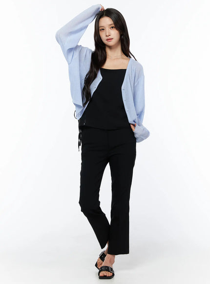 Sheer V-Neck Cardigan CU522 in light blue, full-body front view on model, lightweight sheer knit, styled with black cami, black straight-leg pants, and buckle sandals.