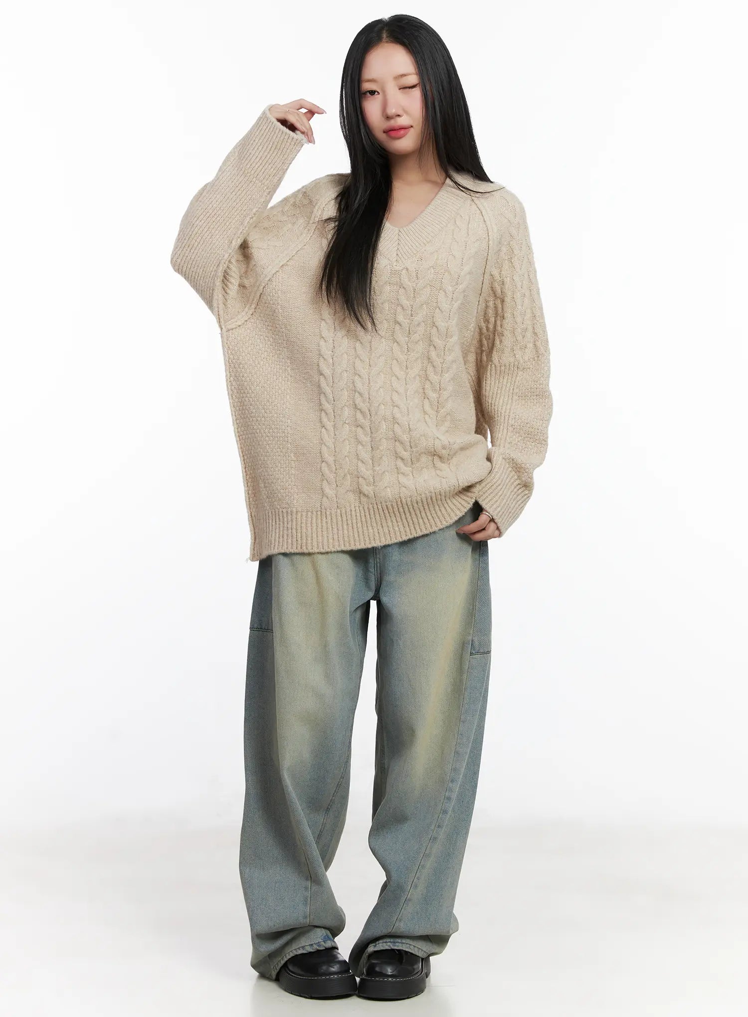 Lyla Washed Wide Leg Jeans CD530 in light blue, full-body front on model, relaxed wide fit with vintage washed finish, paired with oversized beige cable-knit sweater and black loafers.