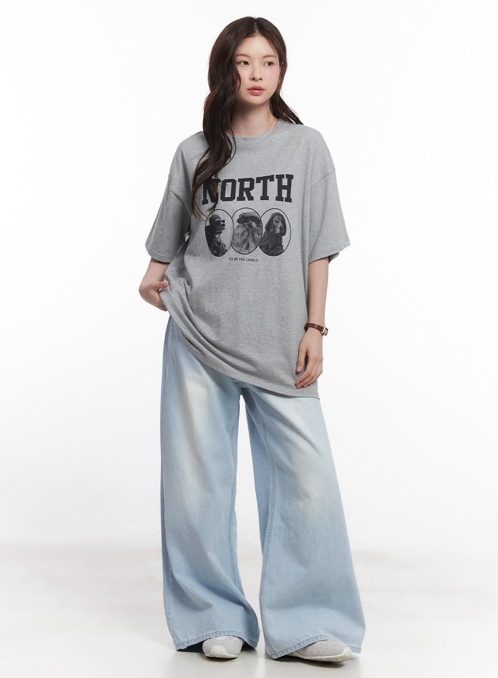 Judie Washed Wide-Leg Jeans CY519 in light blue, full-body slightly angled front shot on model, wide washed denim leg with sun-faded detail, styled with oversized gray graphic tee.