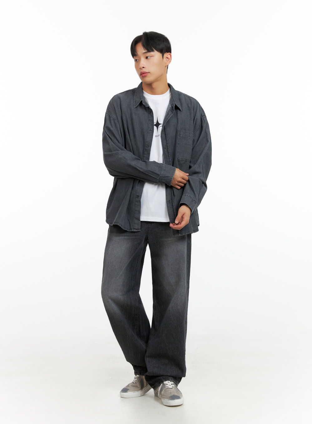 Men's Loose Fit Straight Jeans IU412 in washed black, three-quarter front view on model with relaxed pose, loose wide-leg silhouette, paired with grey overshirt and white tee, sneakers.