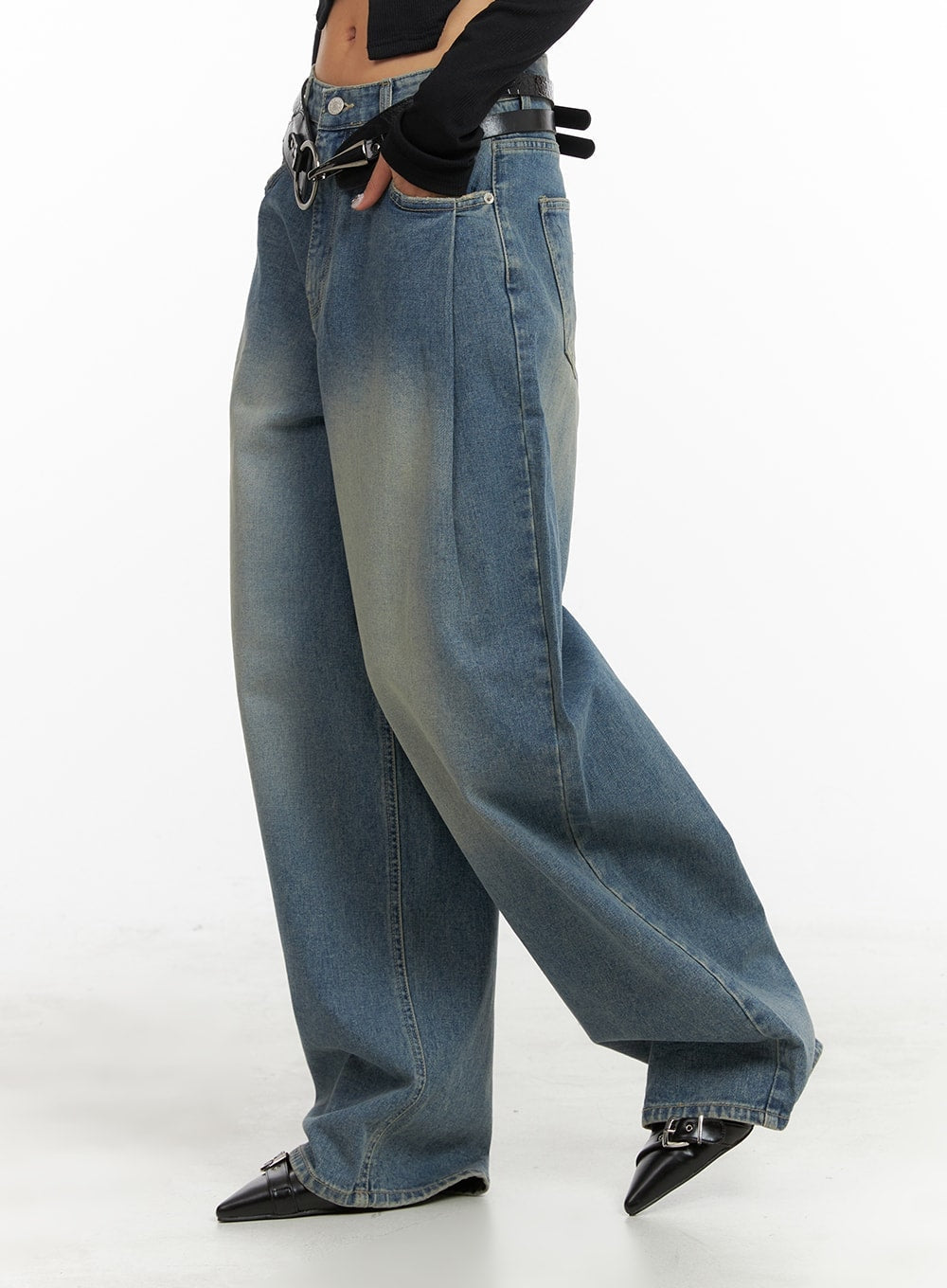 Washed Out Wide Fit Baggy Jeans CA416 in blue, side view on model, wide baggy leg with front seam detail and washed gradient denim, styled with black belt.