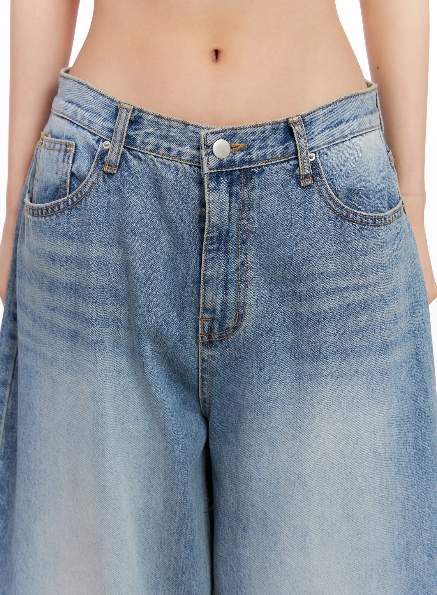 Seojin Washed Wide-Leg Jeans IG508 in blue, close-up detail on waistband and front pockets, showing button closure, contrast stitching, and washed cotton texture.