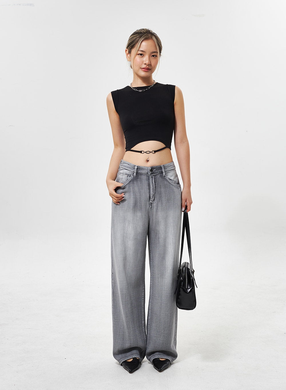 Mid-Rise Wide Leg Jeans CY330 in grey, full-length front shot on model with slight angle, wide-leg faded denim, styled with black crop top and bag.