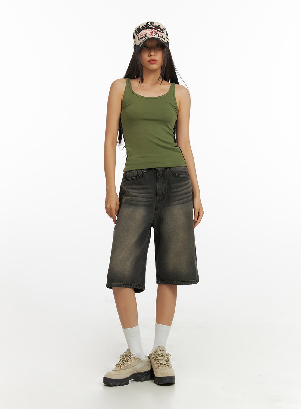 Color Washed Jorts IY422 in black washed denim, full-length front view on model standing straight, wide-leg fit with faded wash, styled with green tank top and bucket hat.