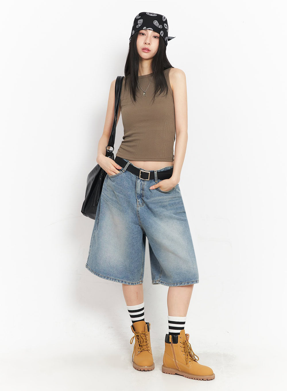 Washed Baggy Jorts IY529 in light blue, three-quarter front shot on model, relaxed wide-fit midi denim, hand in pocket, styled with brown crop tank, black bag, and paisley bandana hat.