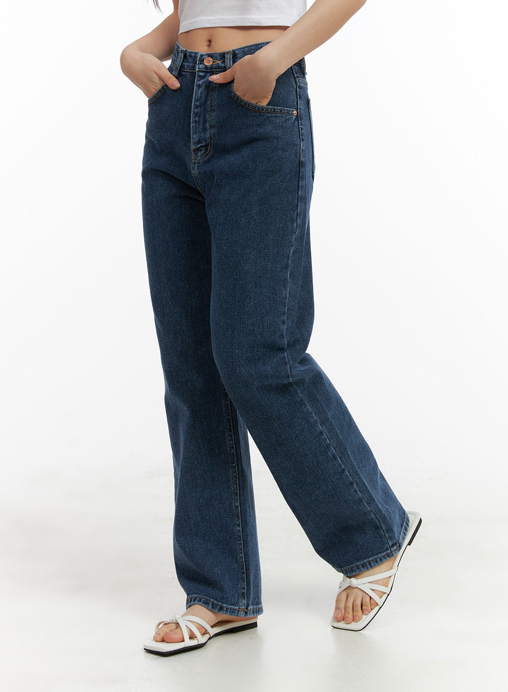 Recycled Straight Fit Jeans OM428 in dark blue, side-view shot on model, highlighting straight-leg silhouette, high rise waistband, and full-length inseam paired with white sandals.