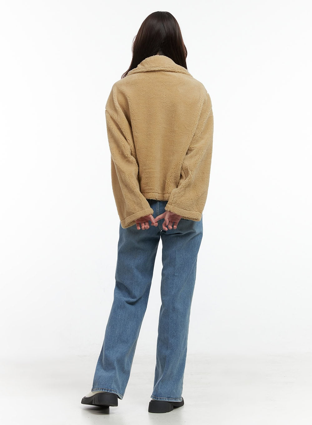 Aubrey Washed Classic Straight-Fit Jeans OO421 in blue, back view on model, wide straight-leg washed denim showing relaxed silhouette, paired with a camel sherpa jacket, black platform loafers.