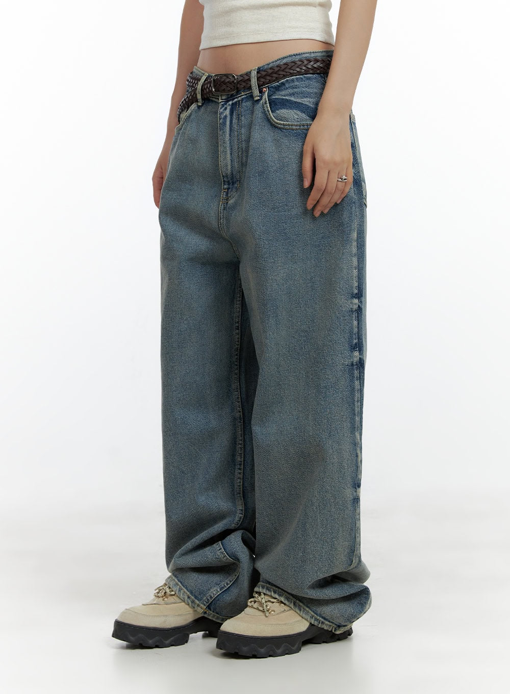 Dark Washed Baggy Jeans CL410 in blue, side close-up on model, low-rise wide-fit washed denim showing side seam and relaxed leg silhouette, with braided belt detail.