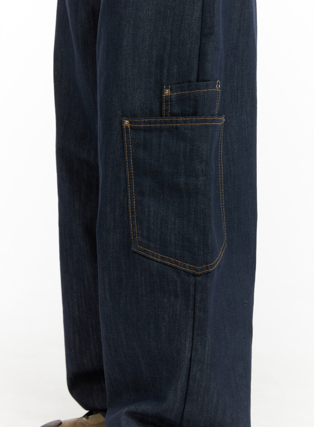 Pocketed Denim Wide Leg Jeans CF423 in dark blue, close-up detail of side cargo pocket, gold contrast topstitching on rigid cotton denim, rivet hardware accents visible.