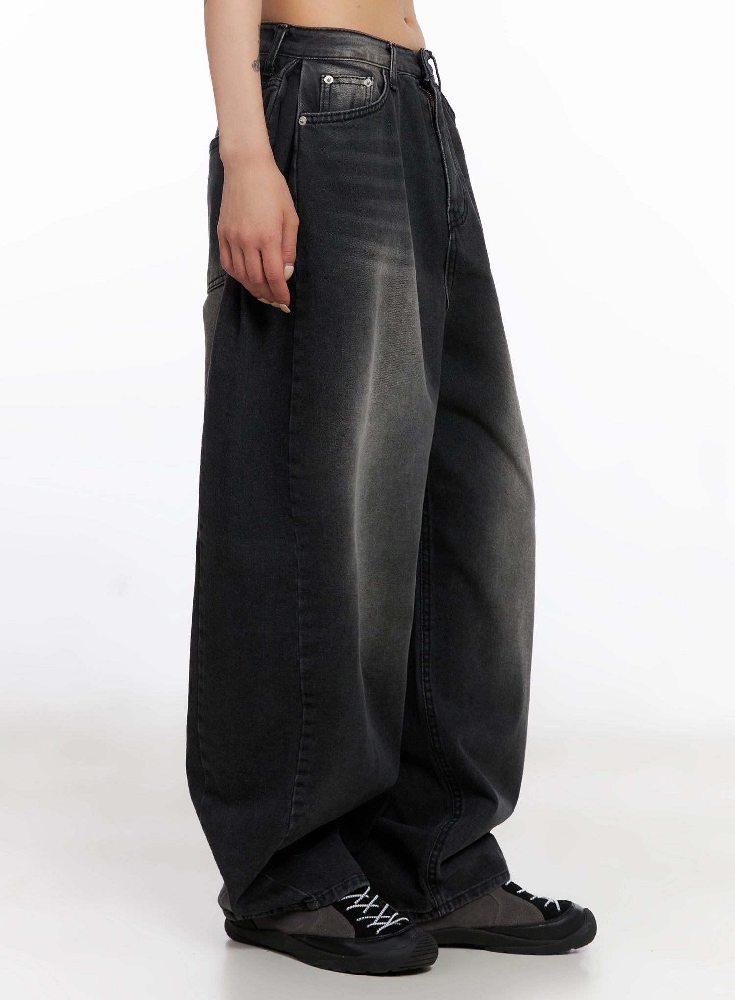 Ayra Dark Washed Baggy Jeans IS508 in dark grey, side close-up on model from waist to hem, showing extreme wide-leg silhouette, faded wash gradient, and pooling hem over chunky sneakers.