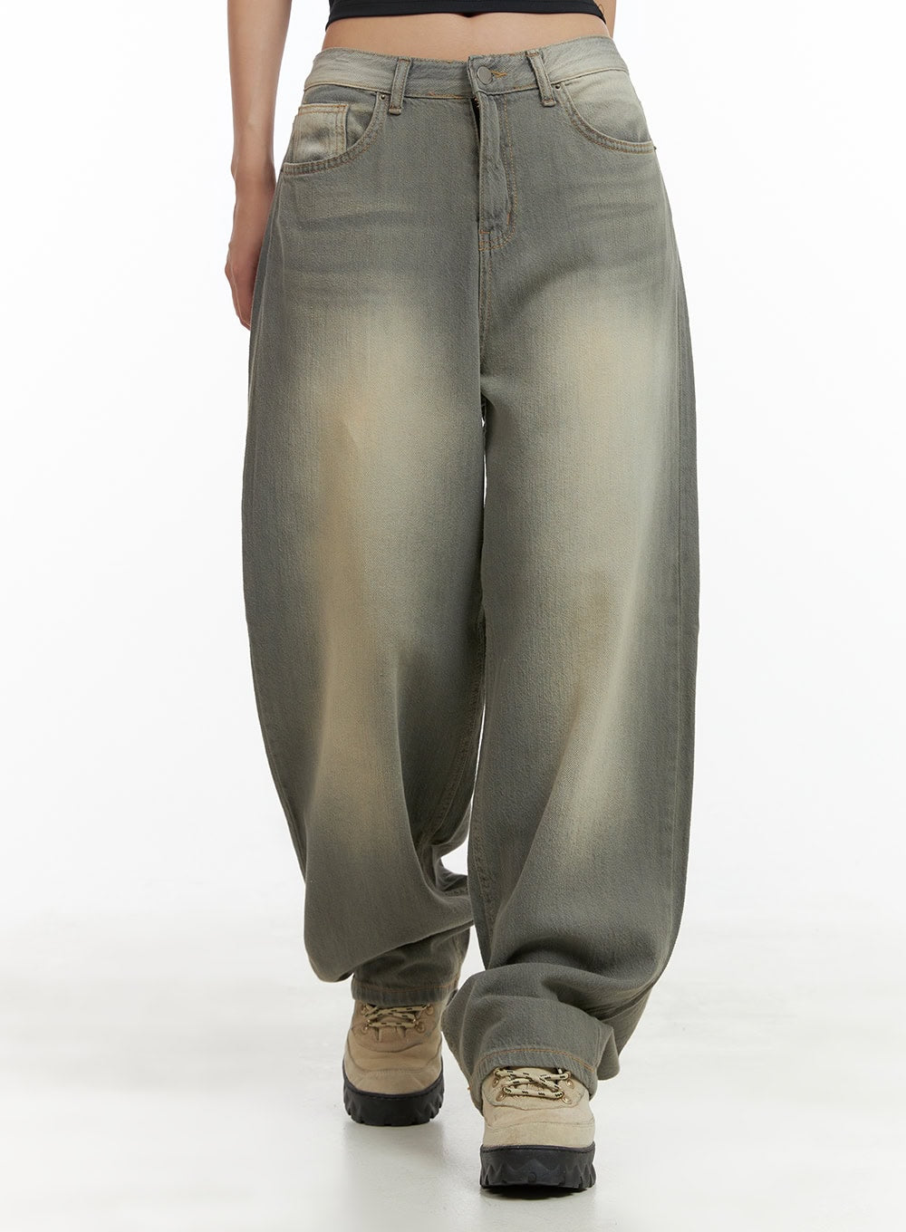 Washed Baggy Denim Jeans CU404 in Brown, front mid-shot on model, wide baggy fit with yellow-toned washed denim, voluminous thighs tapering to pooling hem, chunky boots.