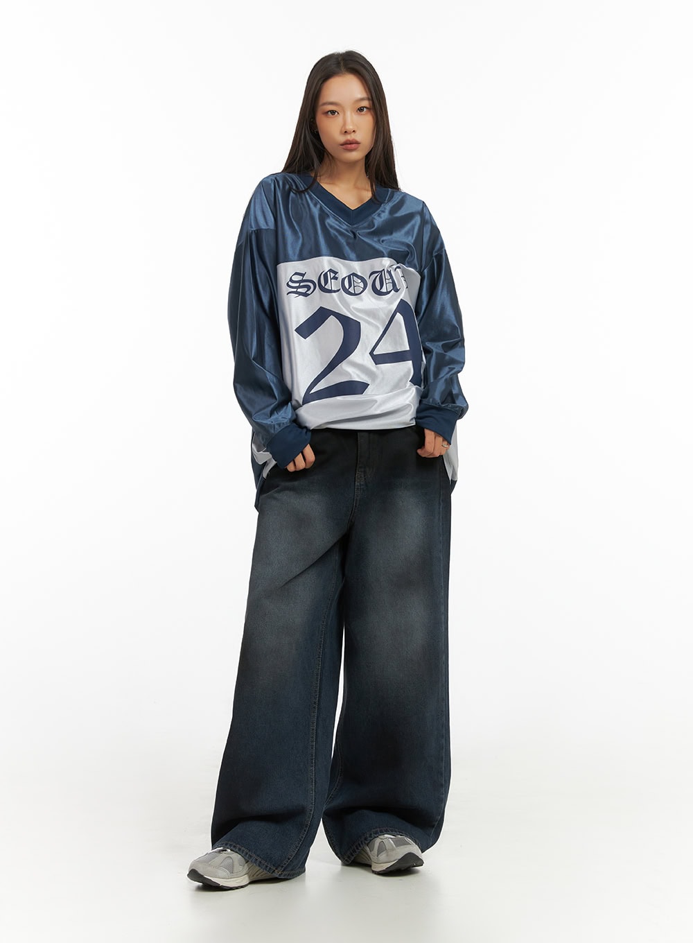 Imogen WashedSky Loose-Fit Denim IO409 in dark blue, full-body front standing pose on model, baggy wide-leg washed denim, styled with oversized Seoul 24 jersey and grey sneakers.