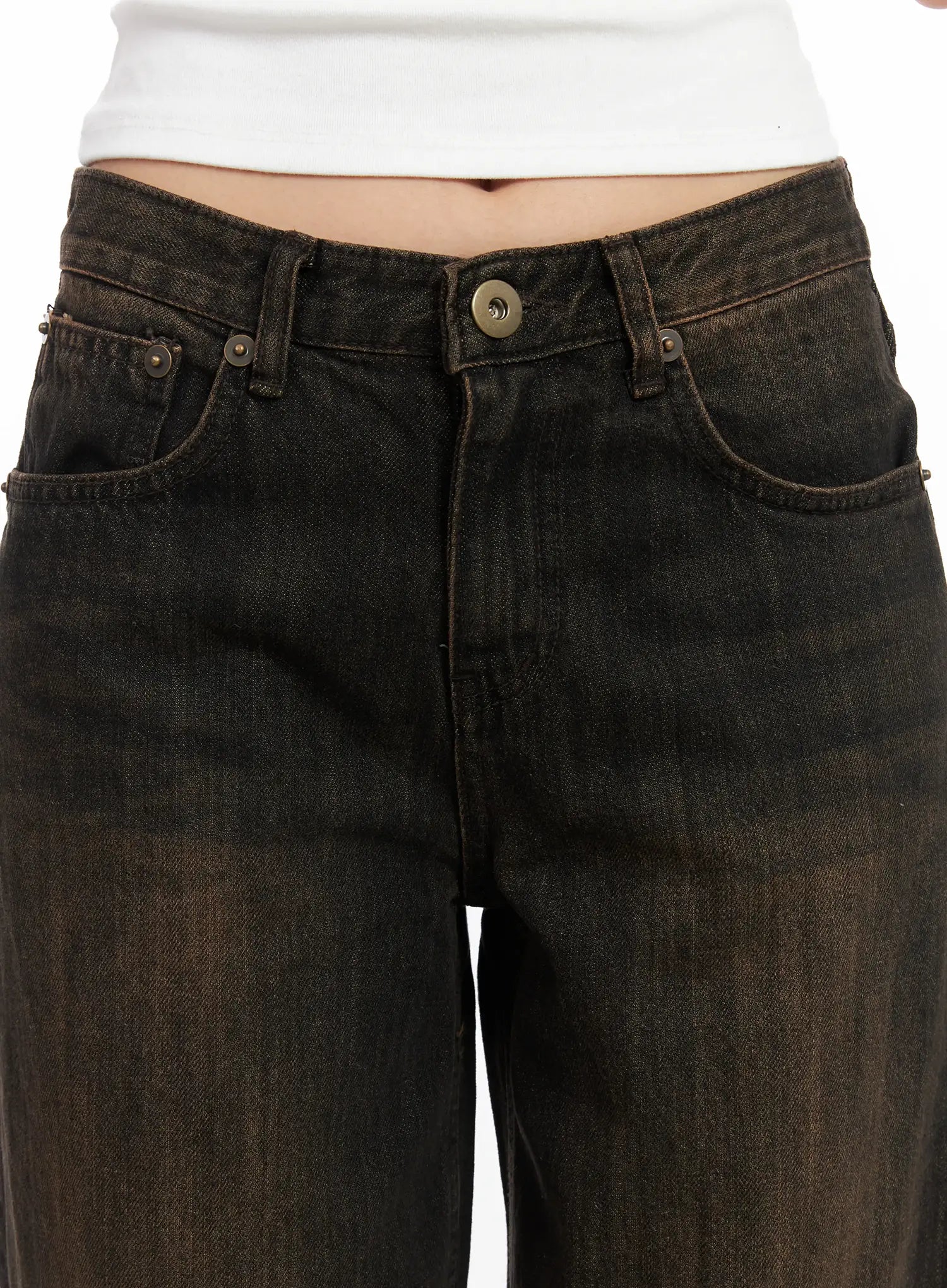 Winnie Brown Baggy Jeans CD502 in Black, close-up of waistband and front pockets, showing washed denim texture, antique button, and rivet hardware detail.