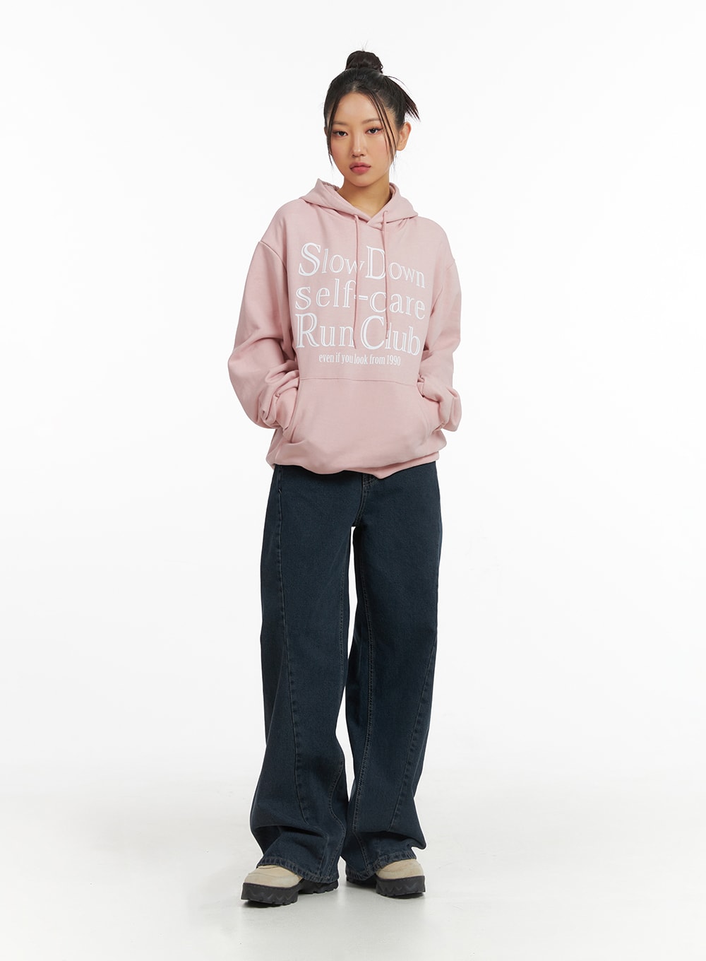 Washed Wide Leg Jeans CJ429 in dark blue, full-body front shot on model, floor-grazing wide leg fit in washed cotton denim, paired with oversized pink graphic hoodie.