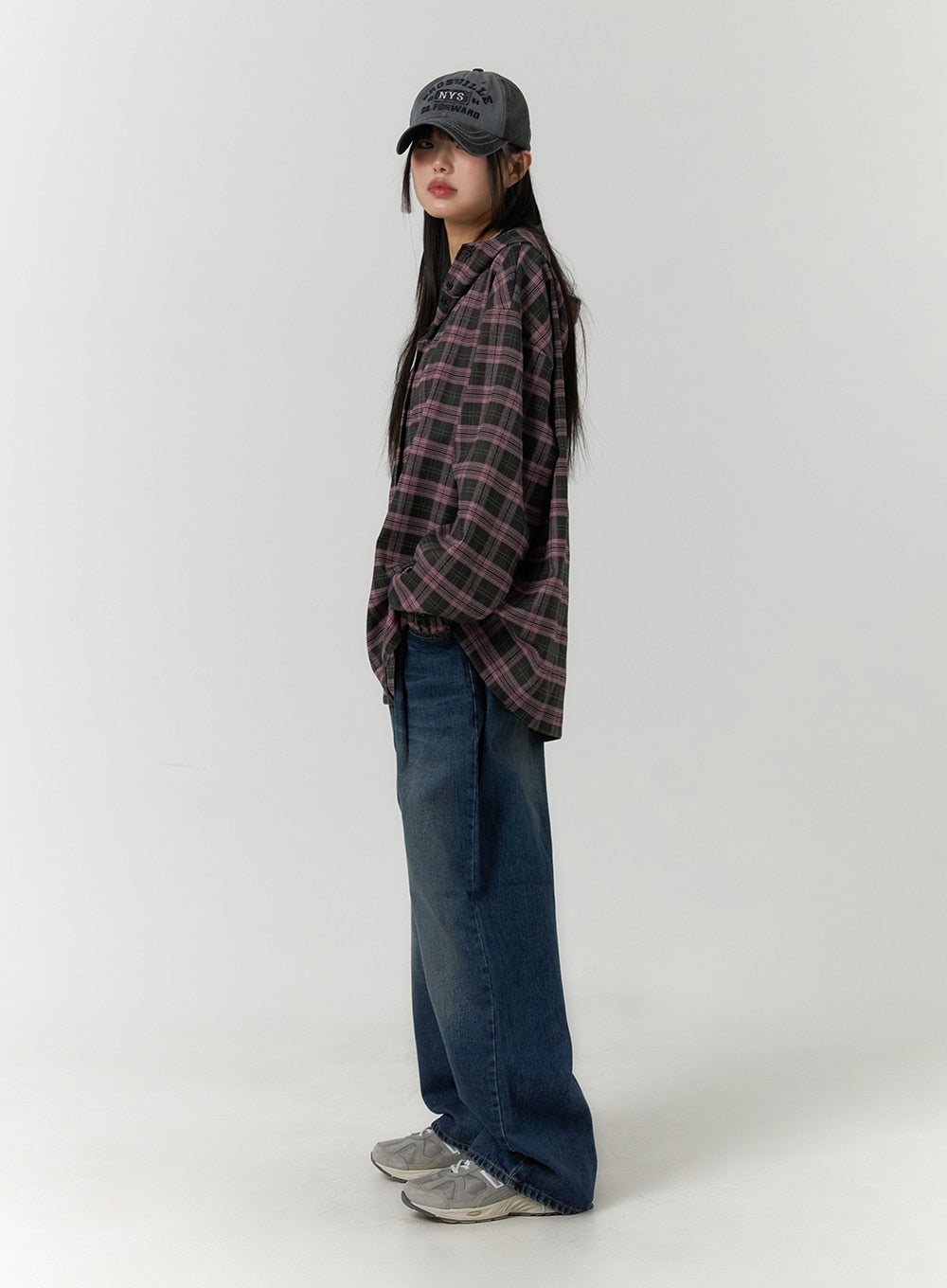 Wide Leg Washed Denim Jeans CF407 in blue, full-length side view on model, wide-leg cotton denim with washed gradient, layered under an oversized plaid shirt and cap.