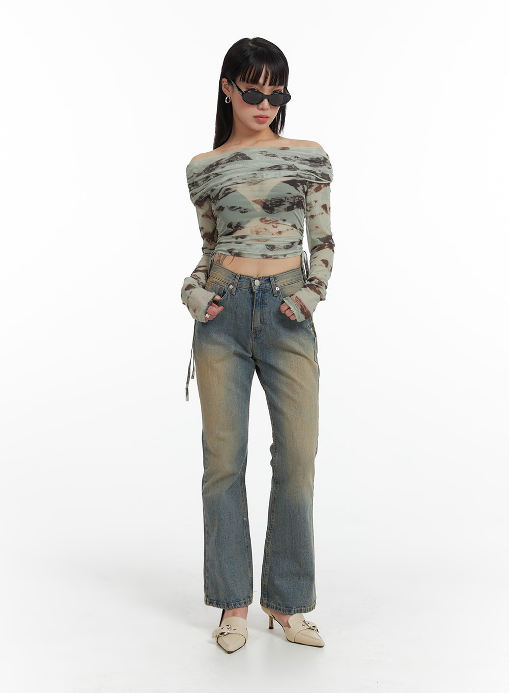 Washed Flared Jeans IF426 in blue, full-length front view on model standing straight, slim bootcut silhouette with sandy wash effect, styled with off-shoulder mesh top.