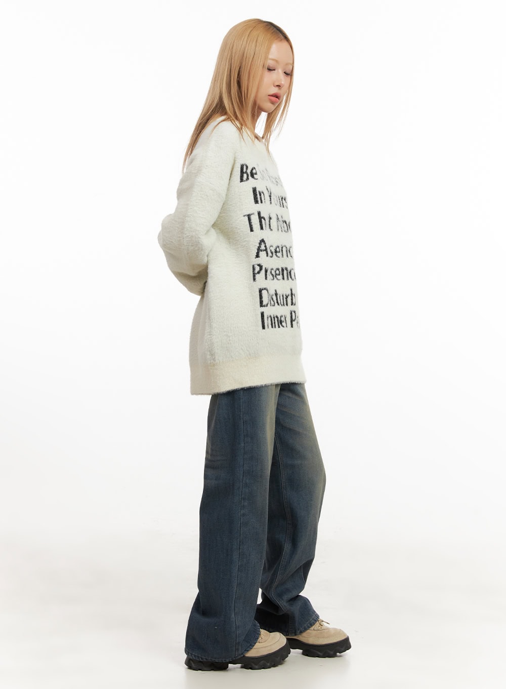 Michelle Washed Wide-Leg Jeans CJ508 in blue, side full-body shot on model looking down, wide-leg washed denim with roomy fit, layered under an oversized cream knit sweater.