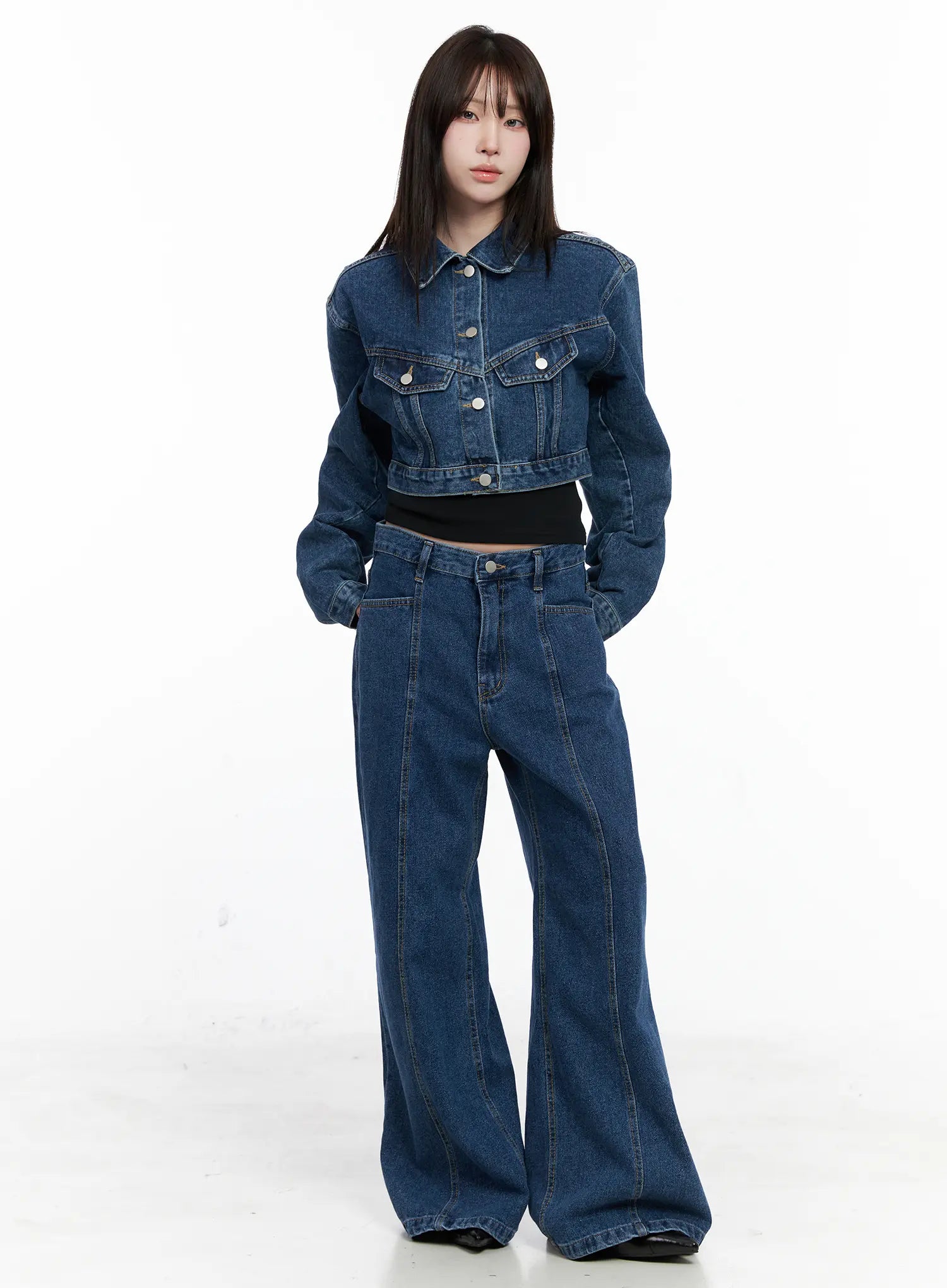 Eliza Seam Detail Relaxed Bootcut Jeans CO521 in washed blue, front full-length on model, paired with cropped denim jacket and black inner, loose relaxed fit with bootcut flare.