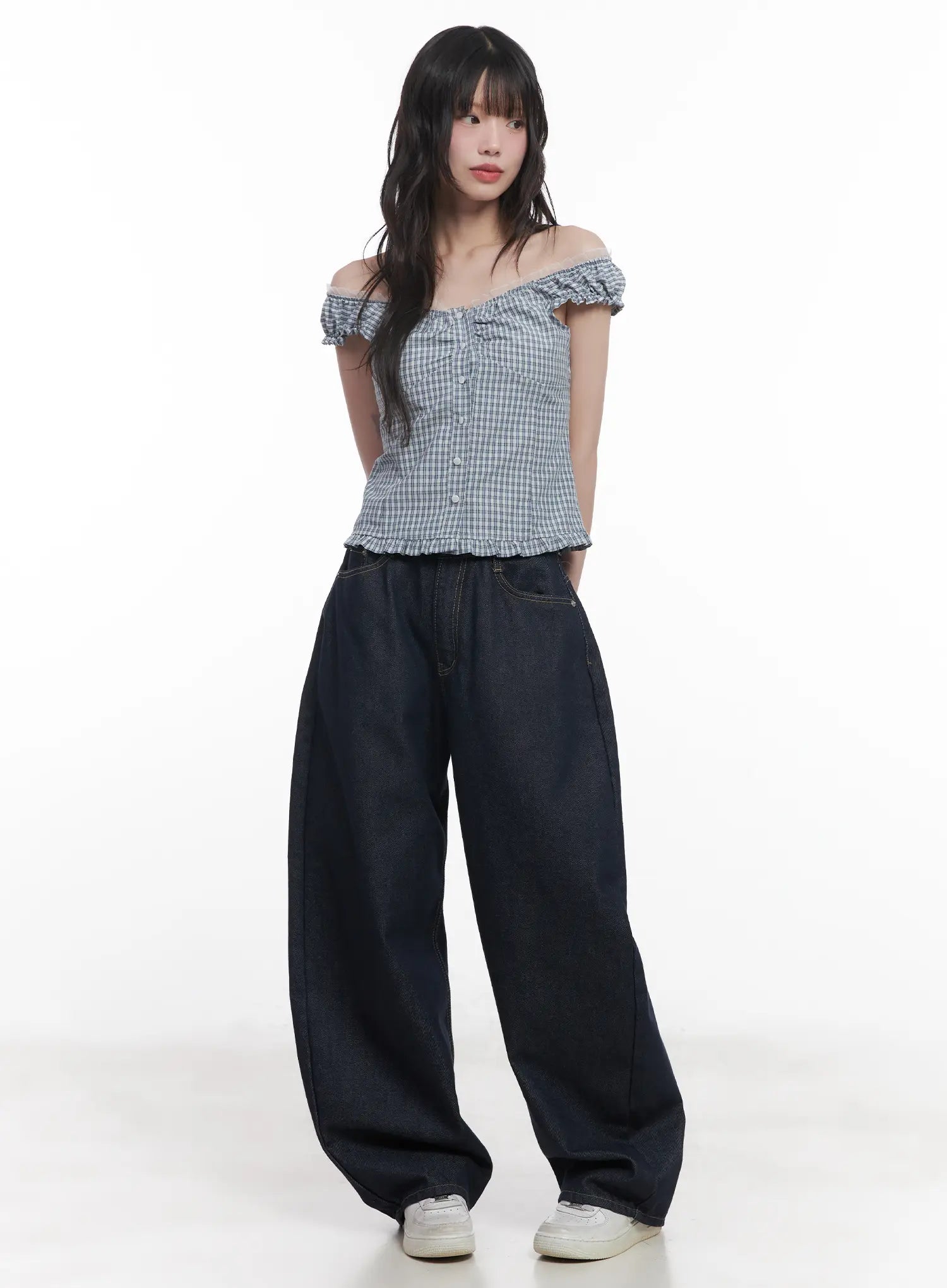 Hyein No-Fade Relaxed-Fit Jeans CU519 in dark blue, full-body front shot on model, voluminous wide-fit denim, paired with blue gingham off-shoulder top and white sneakers.