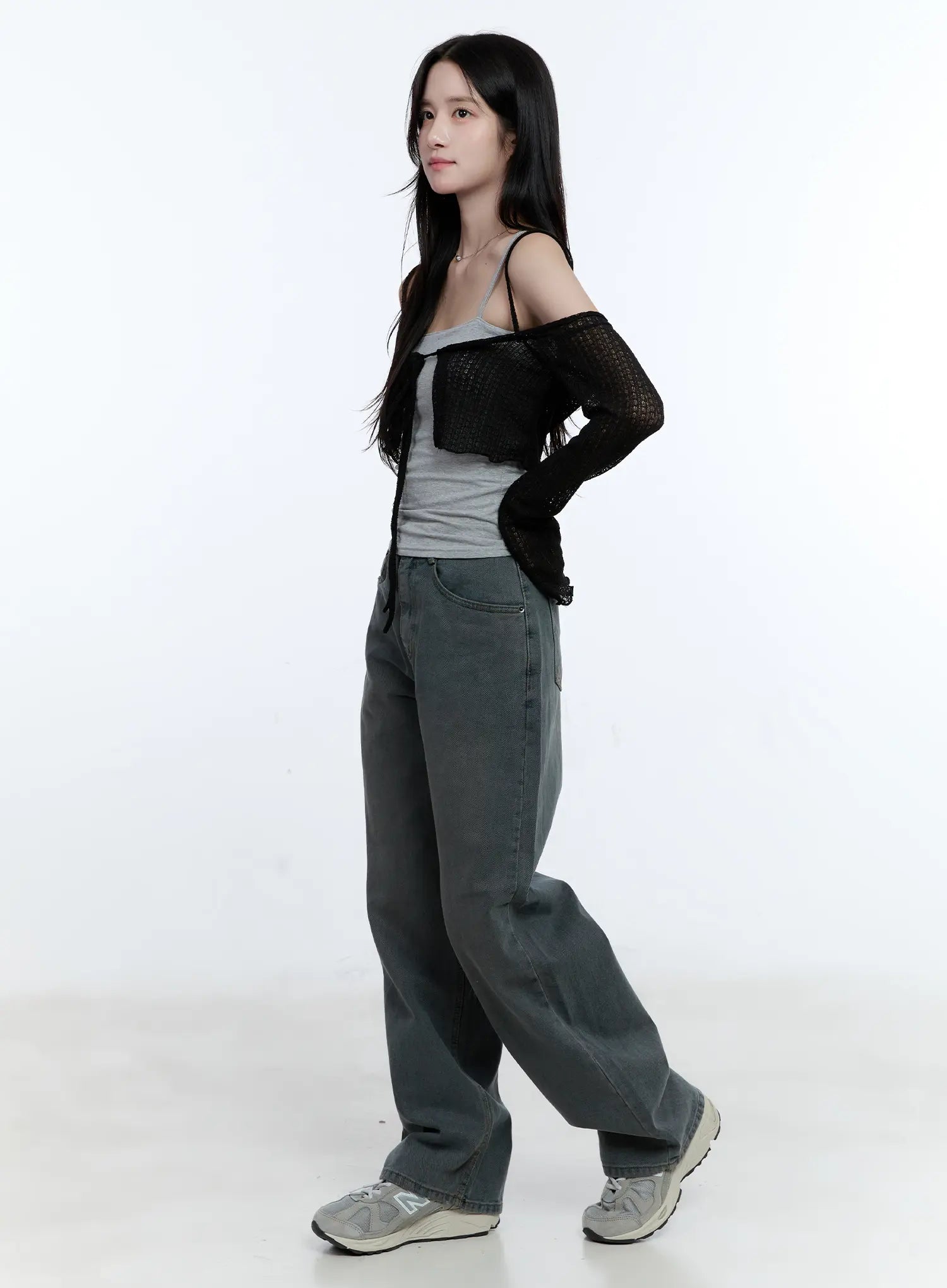 Herri Relaxed Semi-Wide Jeans CG512 in dark blue, side full-body shot on model, washed wide-fit denim showing relaxed silhouette, paired with gray cami and black mesh cardigan.