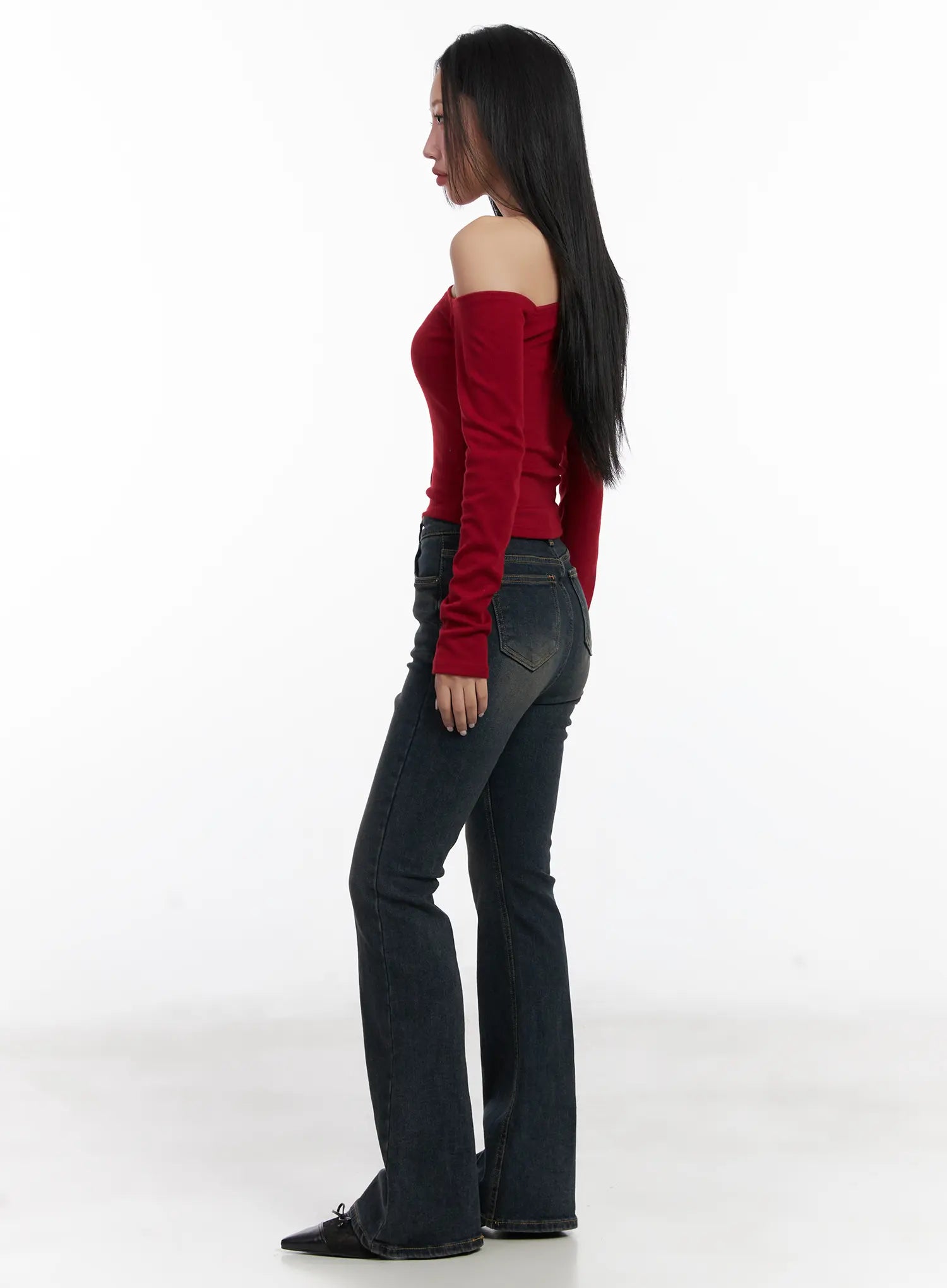 Jay Dark-Wash Bootcut Jeans CD501 in dark blue, side profile full-body shot on model, bootcut flare silhouette with back pockets visible, paired with red off-shoulder top.