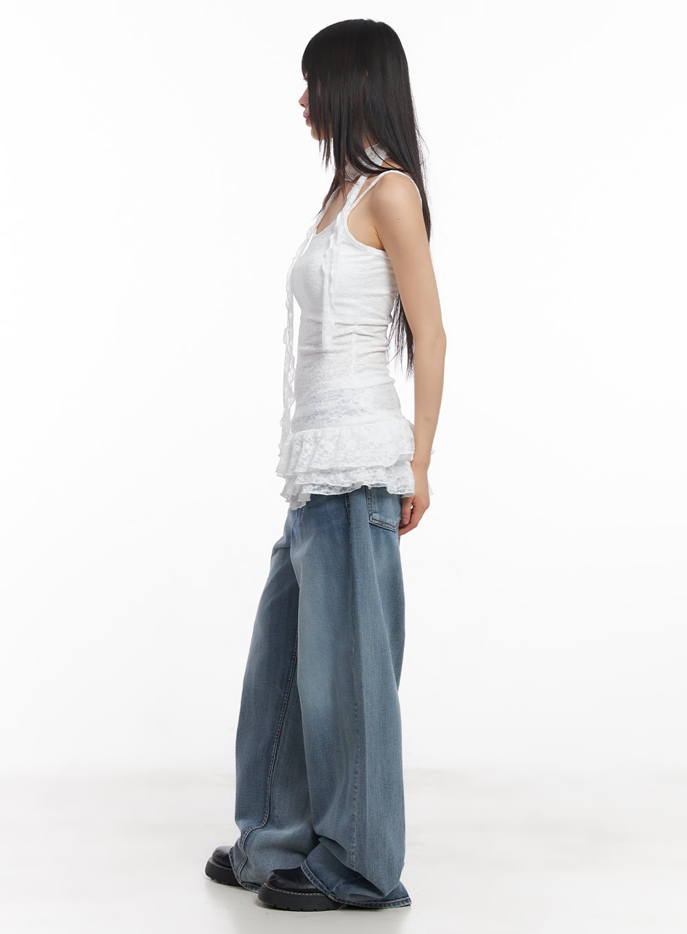 Pauline Wide-Leg Baggy Jeans CY512 in blue, side full-length shot on model, wide baggy silhouette, washed denim drape, paired with white lace cami top.