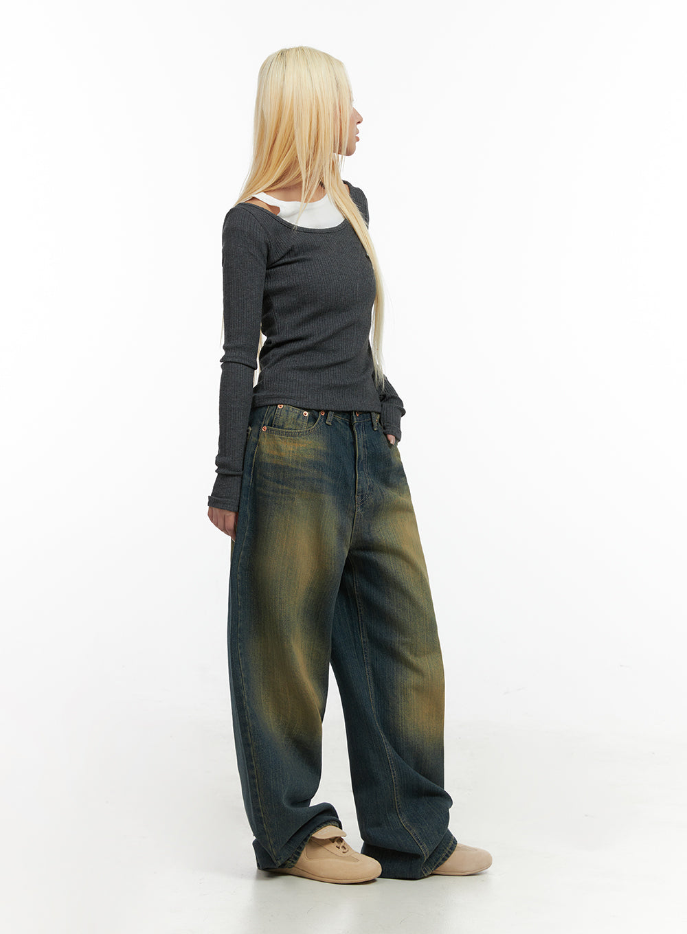 Georgia Vintage Wash Baggy Denim Jeans CO414 in dark blue, side view on model, wide-leg baggy fit with yellow vintage wash fading, paired with grey ribbed top layered over white tee.