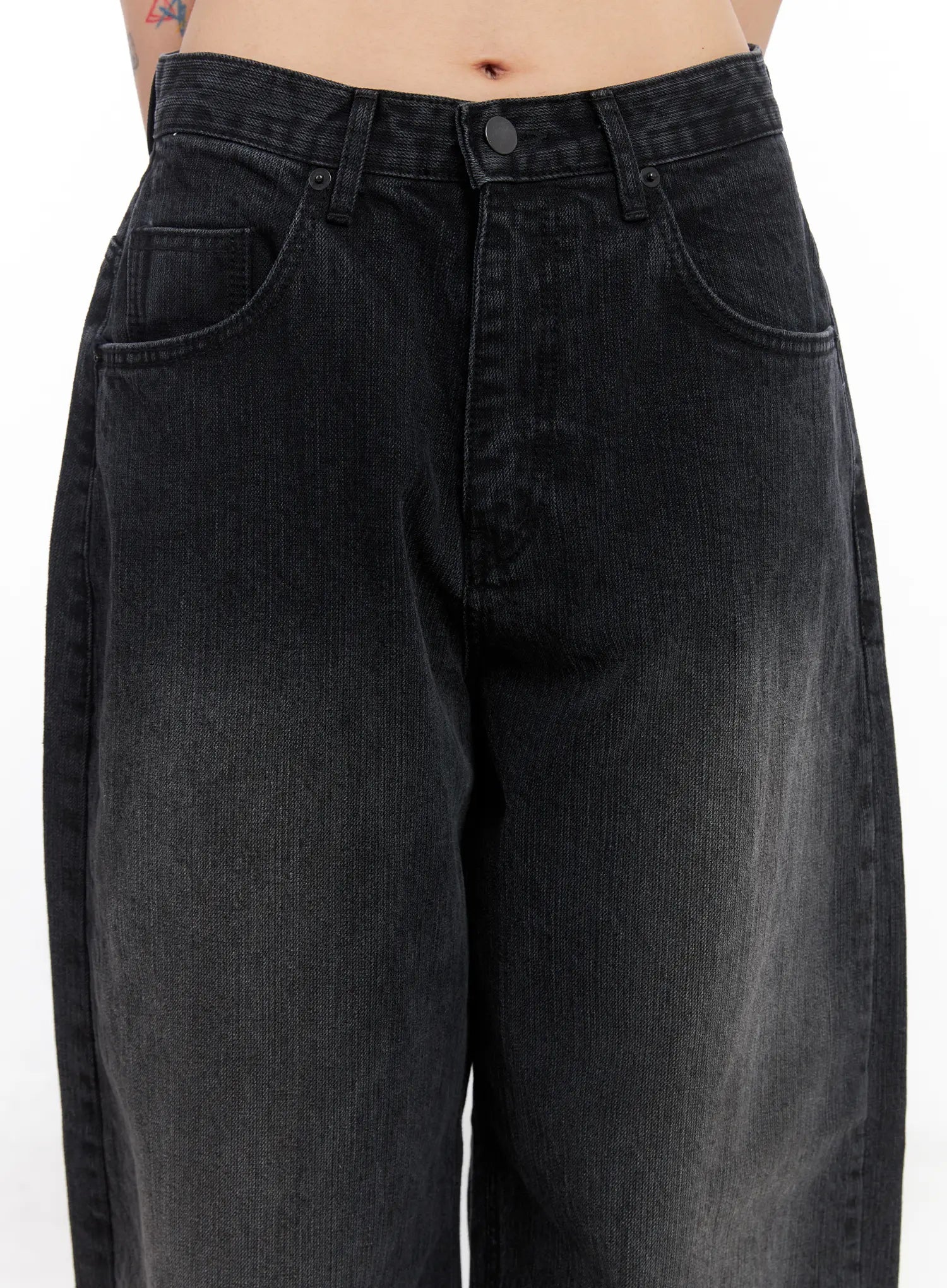 Ivey Washed Baggy Jeans CC1809 in black, waist close-up on model, showing button fly, front pockets, and washed faded cotton denim texture in baggy wide fit.