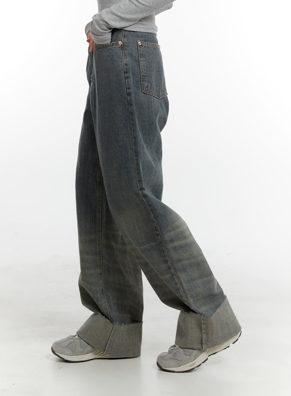 Washed Straight Leg Roll-Up Jeans CA401 in blue, side view on model, wide straight leg silhouette with faded wash gradient and chunky rolled cuff, styled with grey sneakers.