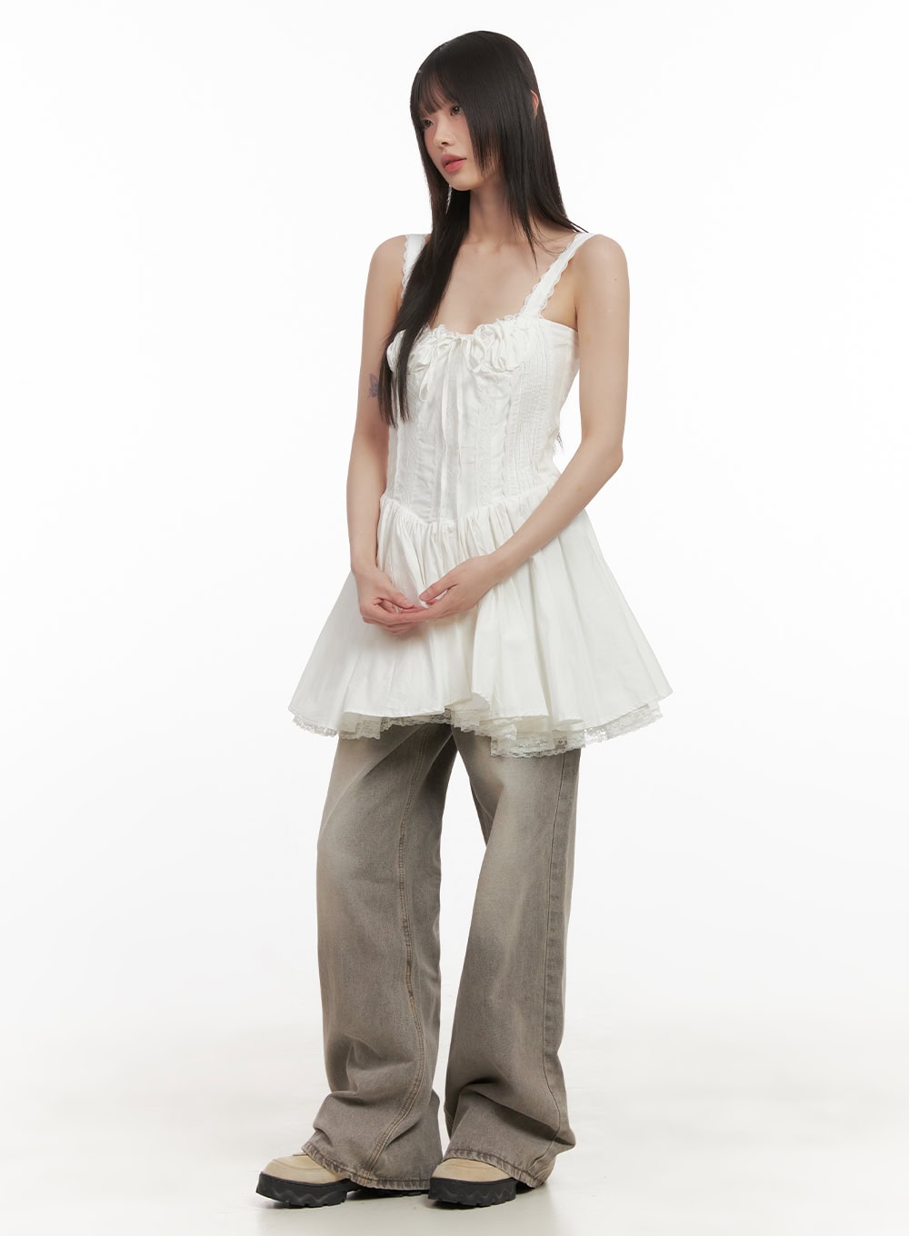 Hollie Vintage Wide-Leg Jeans CD426 in gray, three-quarter front shot on model, wide-fit washed denim paired with white lace-trim corset peplum top and chunky boots.