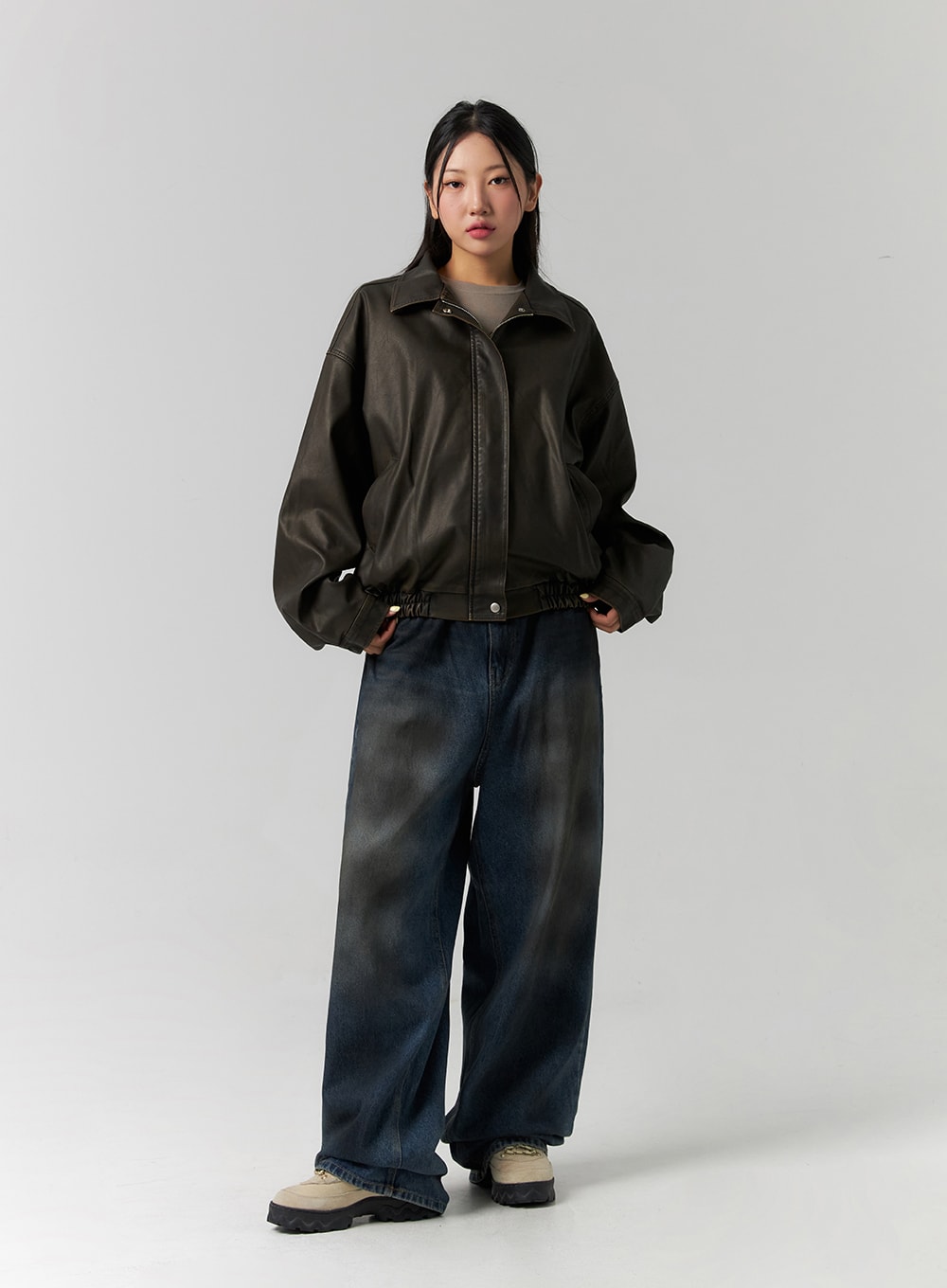 Tie-Dye Washed Wide Leg Jeans CS320 in dark blue, full-body front on model, relaxed wide-fit cotton denim styled with dark leather bomber jacket, hands in pockets.