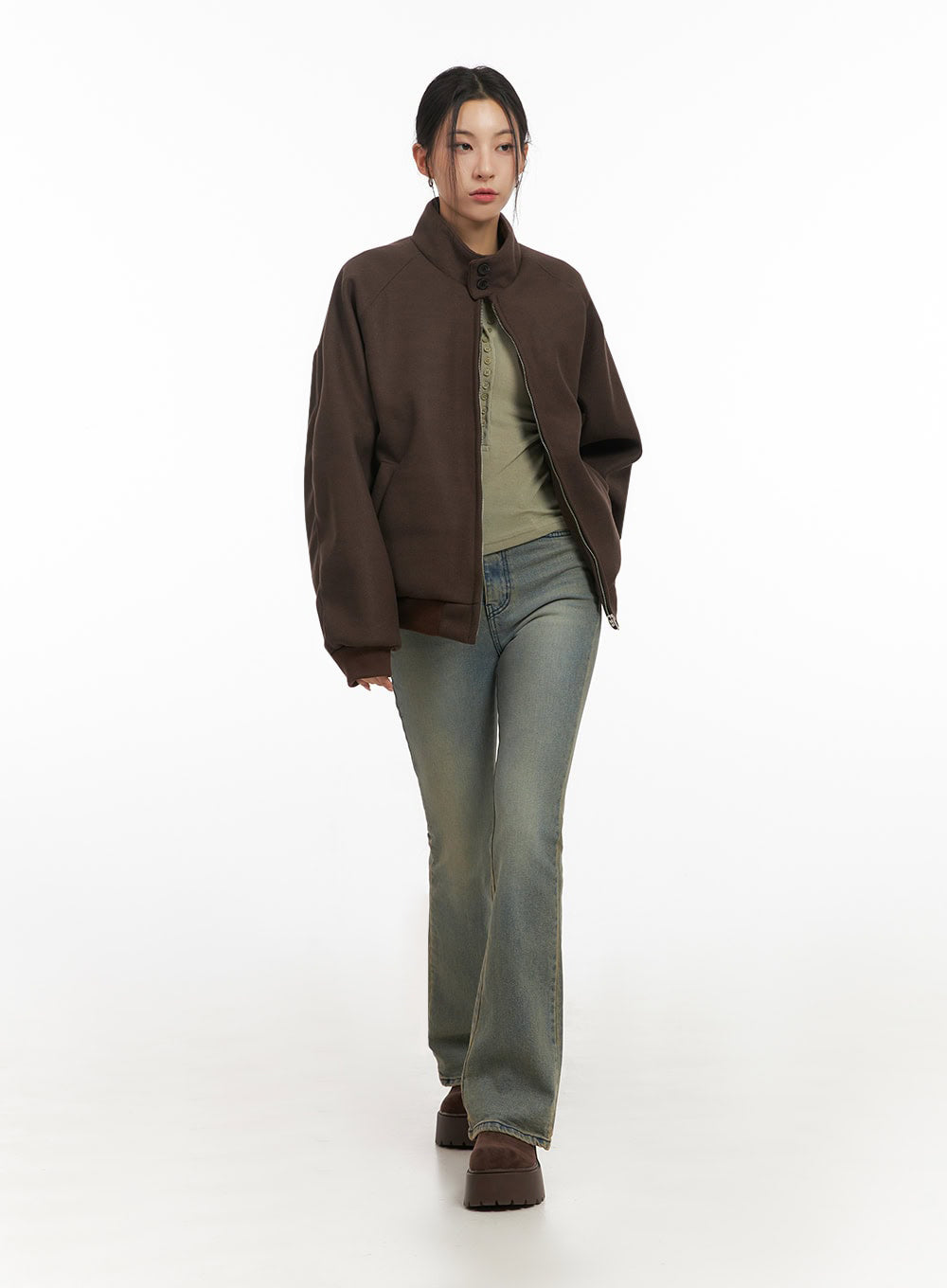 Cathy Washed Slim-Fit Flared Jeans IJ503 in vintage blue, front full-length on model walking, slim bootcut leg, paired with oversized brown jacket and olive ribbed top.