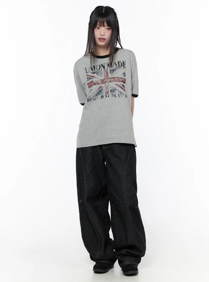 Lova Baggy Jeans CU519 in black, full-length front on model with grey Union Made graphic tee, baggy fit denim with contrast stitching and stacked hem.