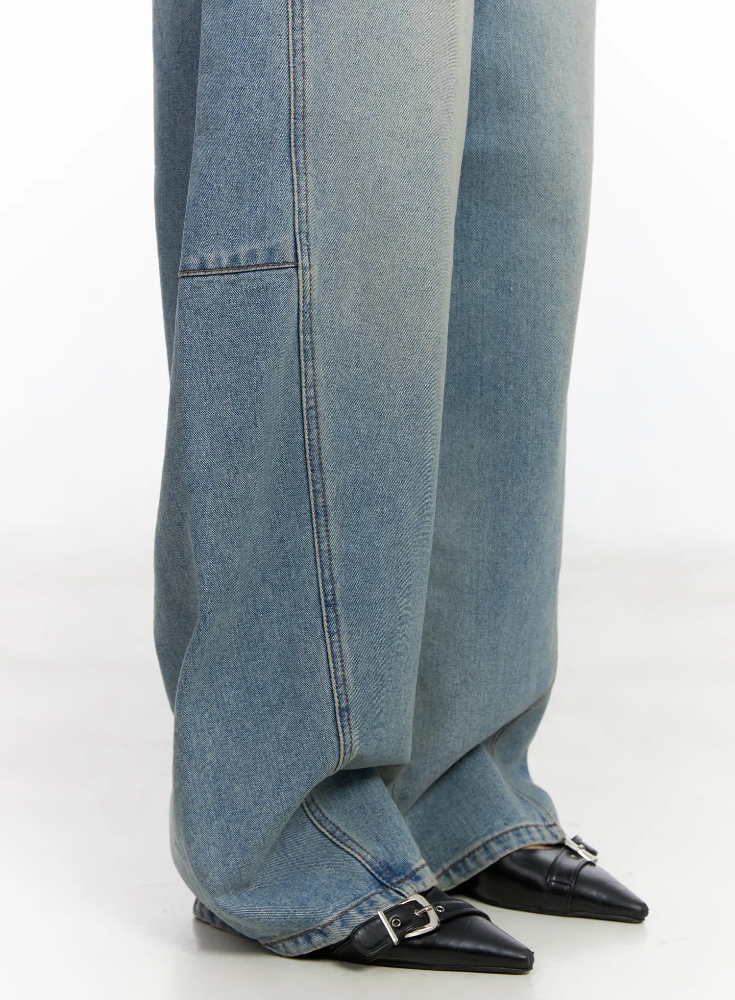 Frey Washed Wide-Leg Jeans CJ523 in light blue, lower-leg close-up on model, showing voluminous wide hem, panel seam detail, pooling over black buckle flats.