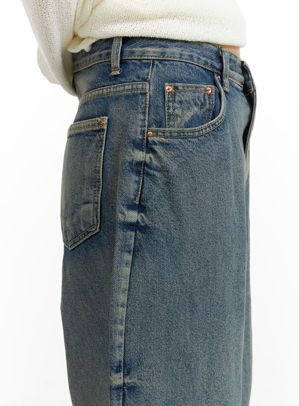Urban Chic Washed Baggy Jeans CM411 in blue, close-up of back waist and pocket detail, showing copper rivets, five-pocket construction, and vintage washed denim texture.