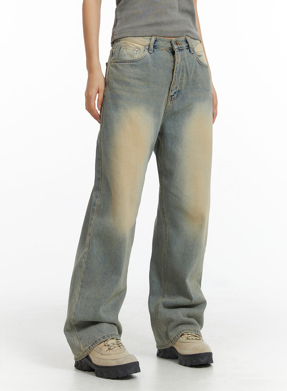 LEWKIN Dark Wash Jeans CF303 in blue, front three-quarter crop shot on model, wide-leg cotton denim with sandy yellow washed fading at thighs, paired with grey top and chunky boots.
