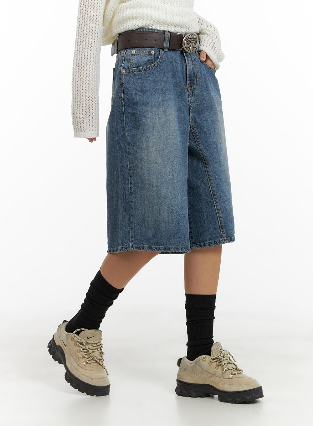 Vintage Washed Wide Leg Jorts CA415 in blue, side view on model mid-stride, wide-leg silhouette with vintage wash and front seam detail, styled with cream knit and chunky sneakers.