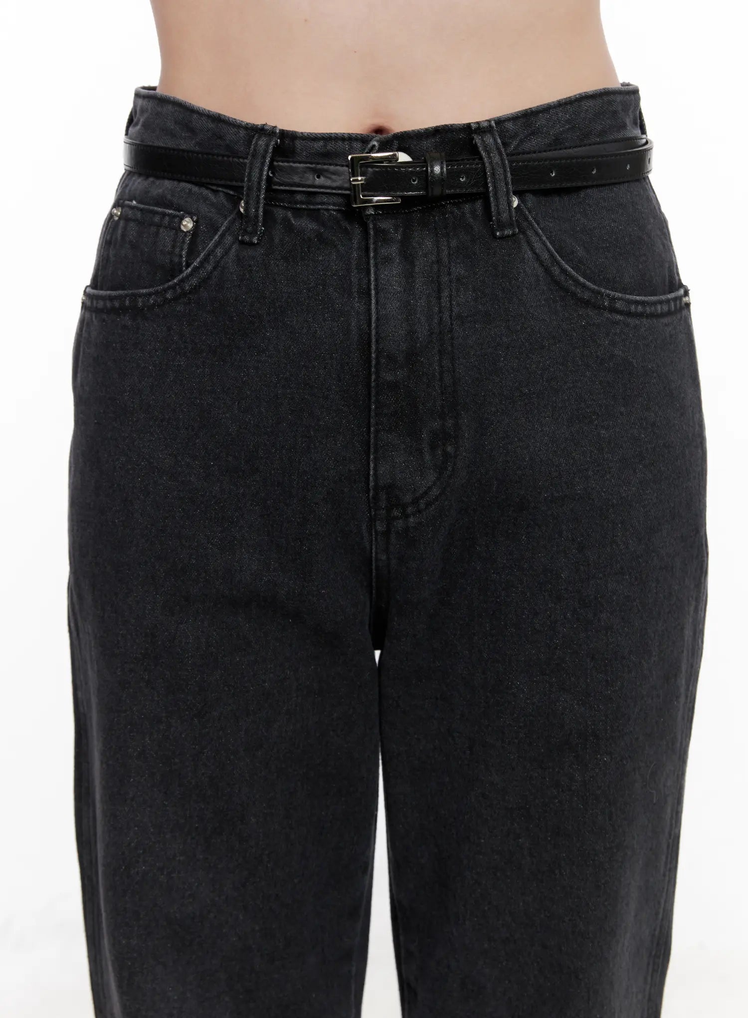 Eileen Belted Flare Jeans CN504 in washed black, waist close-up on model, featuring slim leather belt with silver buckle, five-pocket design and washed cotton denim texture.